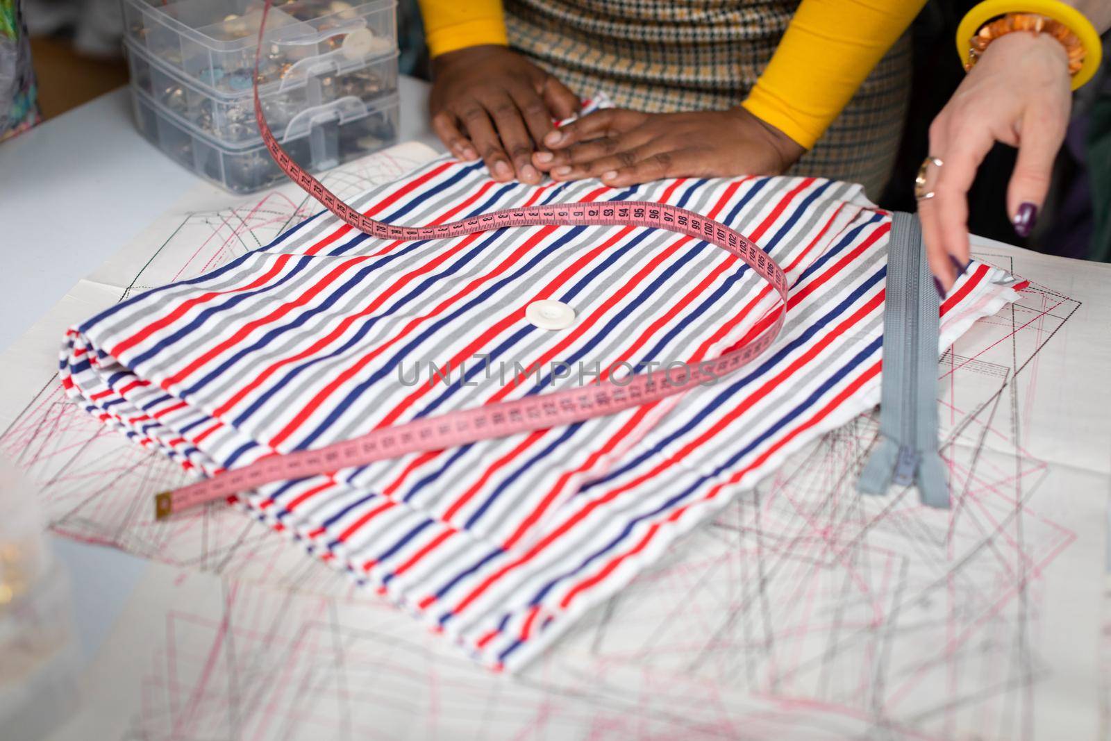 Preparation of tailoring fabric and accessories that will be used to sew the dress. Tailor shop facilities.