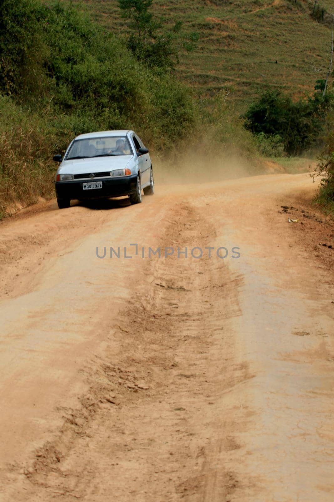 itamaraju, bahia / brazil - august 6, 2008: vehicle travels on a dirt road that connects the municipalities of Itamaraju to Jucurocu in southern Bahia.




