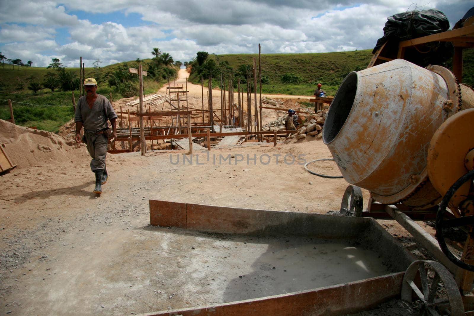 itamaraju, bahia / brazil - august 6, 2008: worker works on building a bridge in the rural area of the city of Itamaraju, in the south of Bahia.
