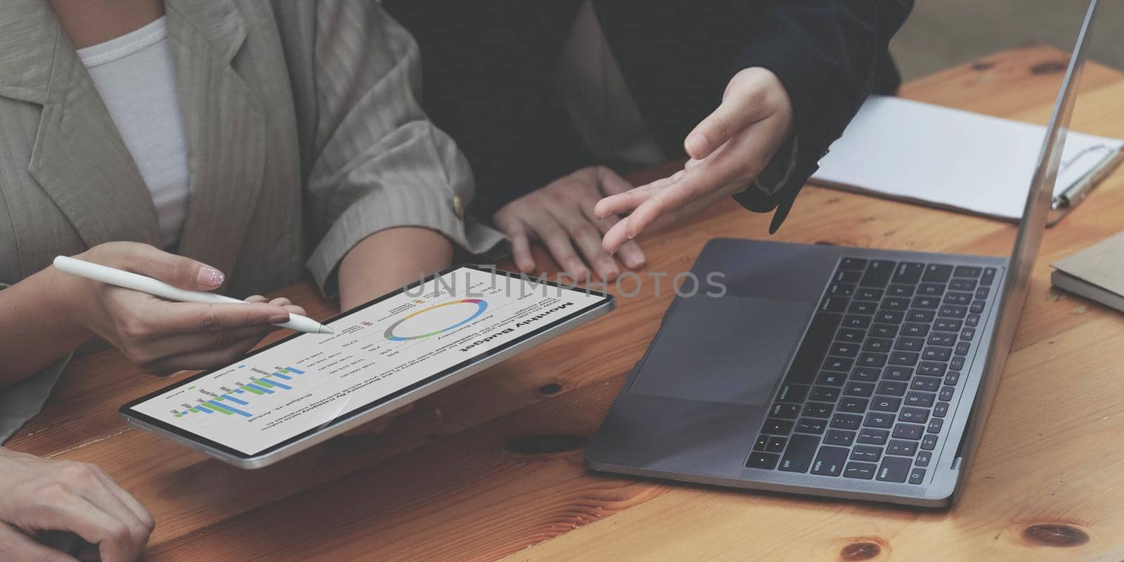 Business people are meeting for analysis data figures to plan business strategies. Business discussing concept.