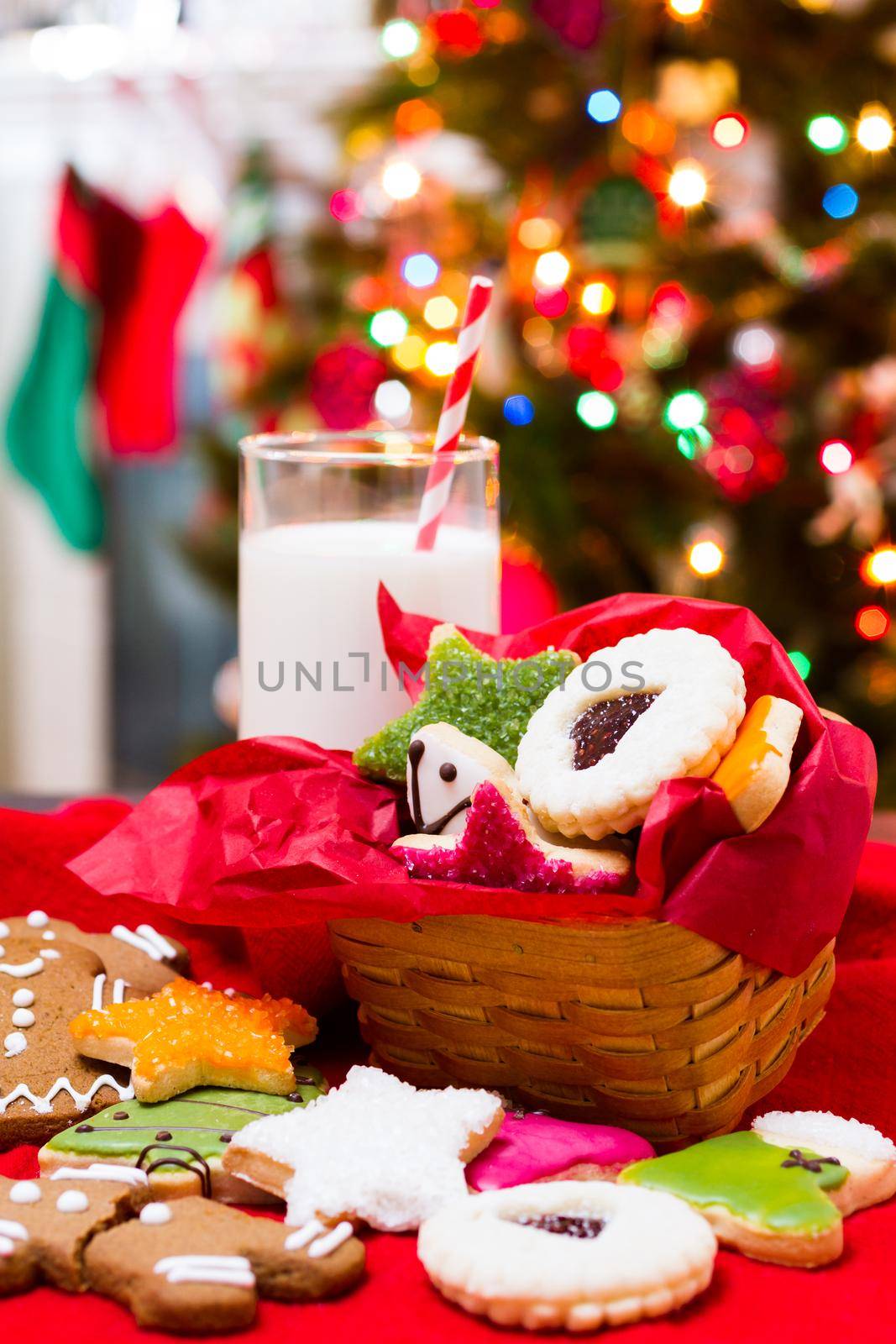 Assorted christmas cookies on red background.