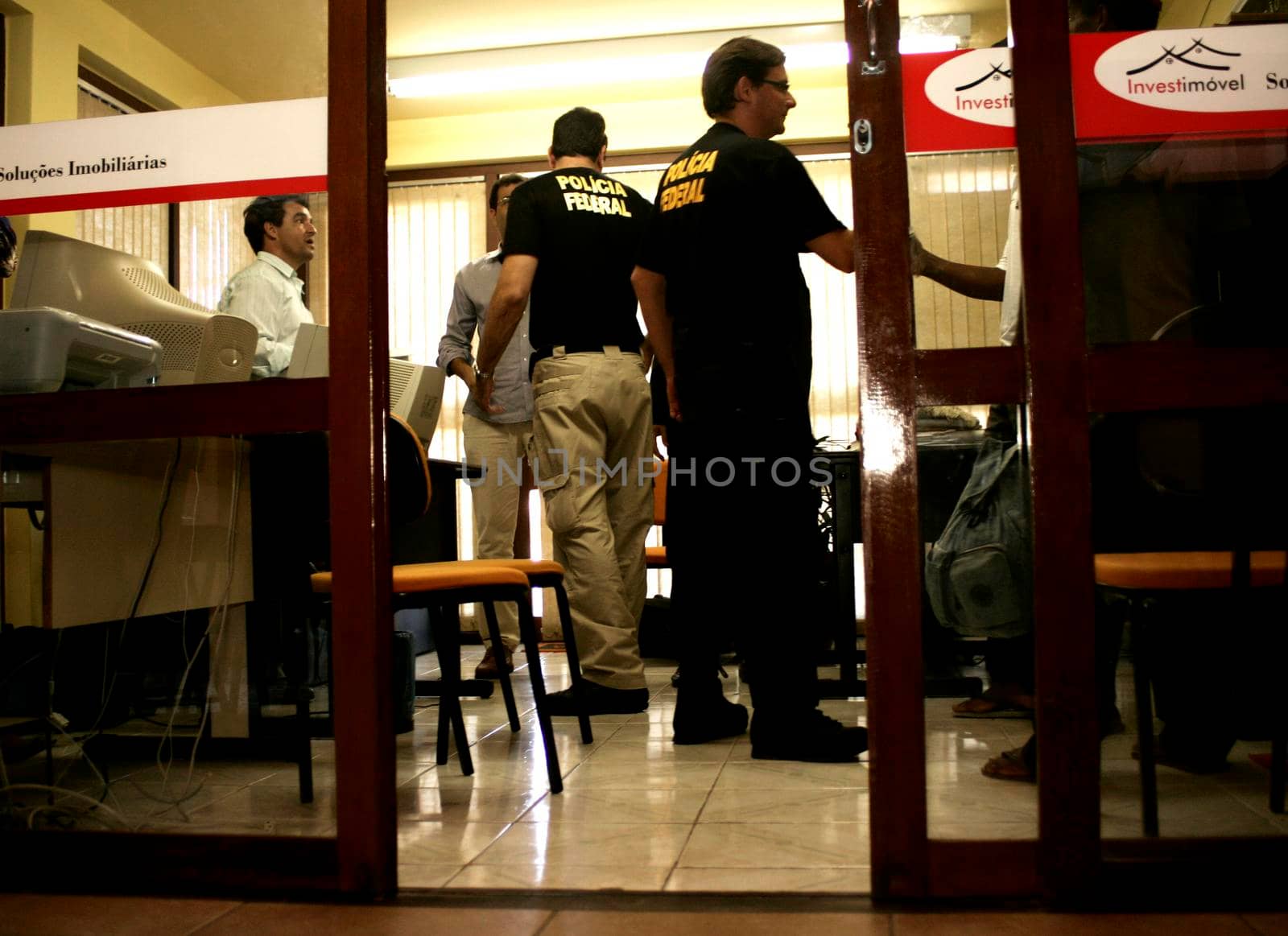 porto seguro, bahia / brazil - august 6, 2009: Federal Police agents are seen during an investigation operation in the city of Porto Seguro, in the south of Bahia.