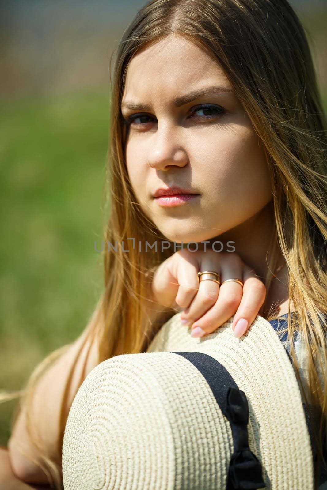 beautiful girl in a dress walking in the spring forest where the trees bloom