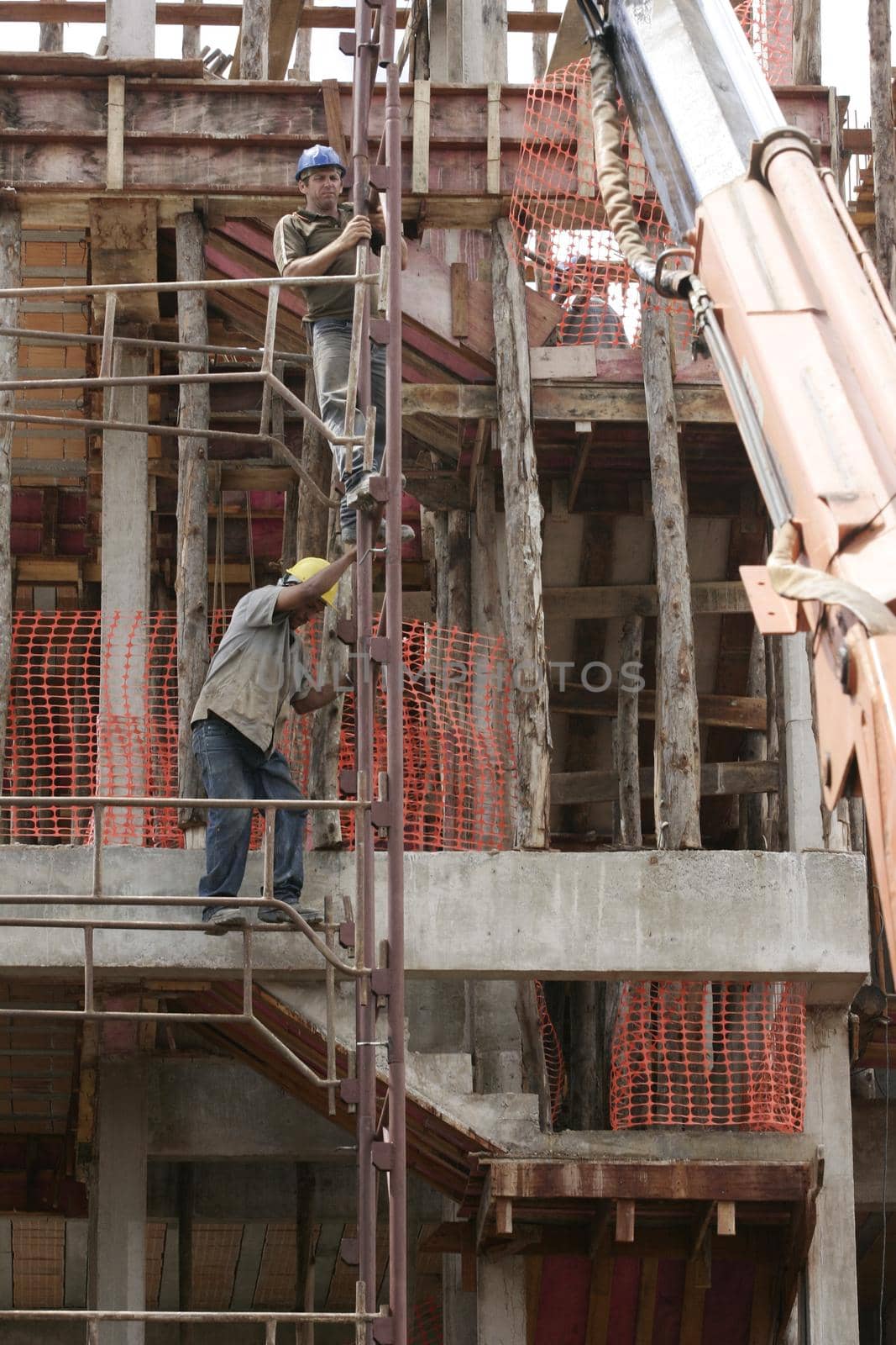 eunapolis, bahia, brazil - august 25, 2009: Construction workers working on construction of a building in the city of Eunapolis.