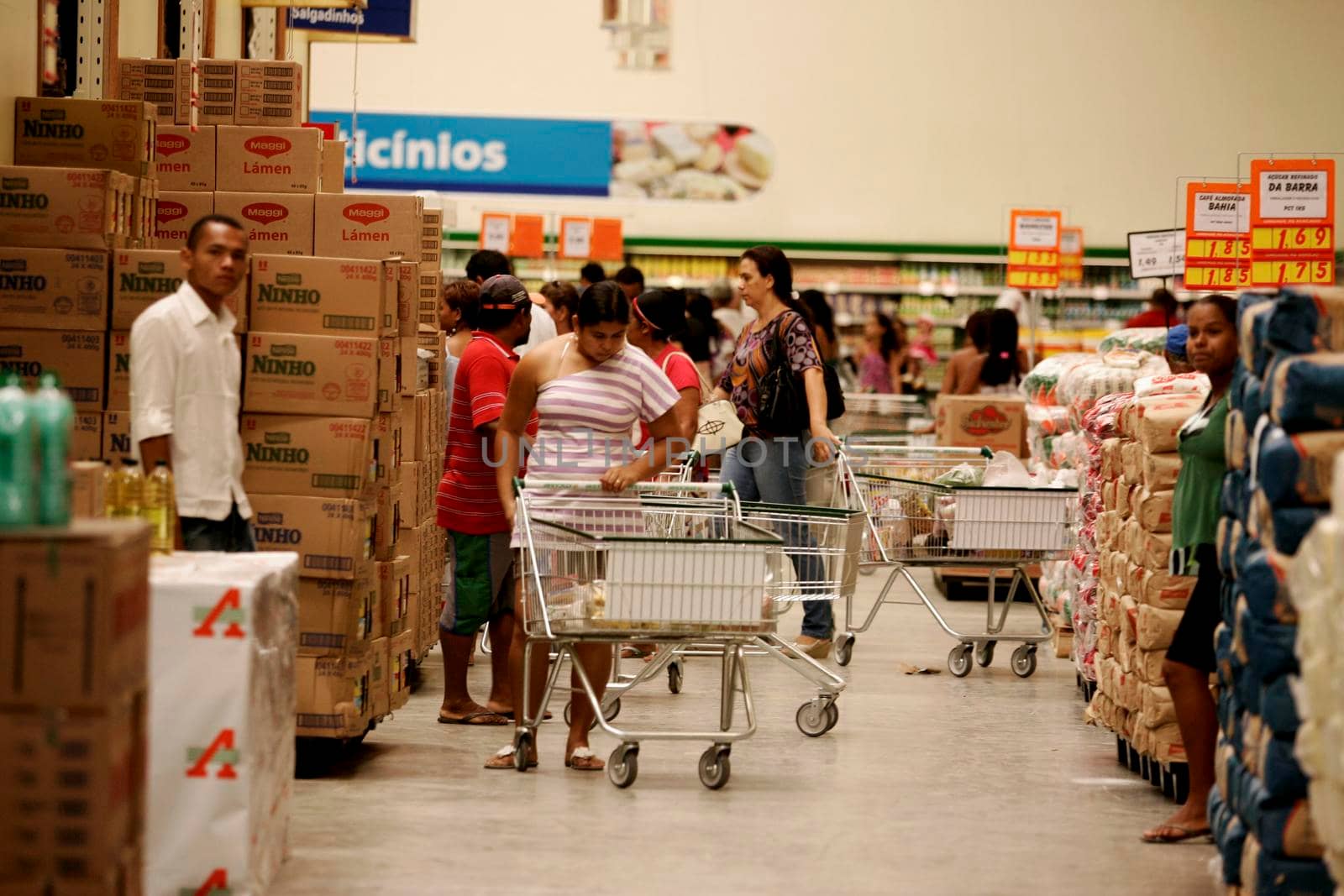 eunapolis, bahia / brazil - august 10, 2009: customers are seen pushing a shopping cart at the Atacadao supermarket in the city of Eunapolis, in southern Bahia.