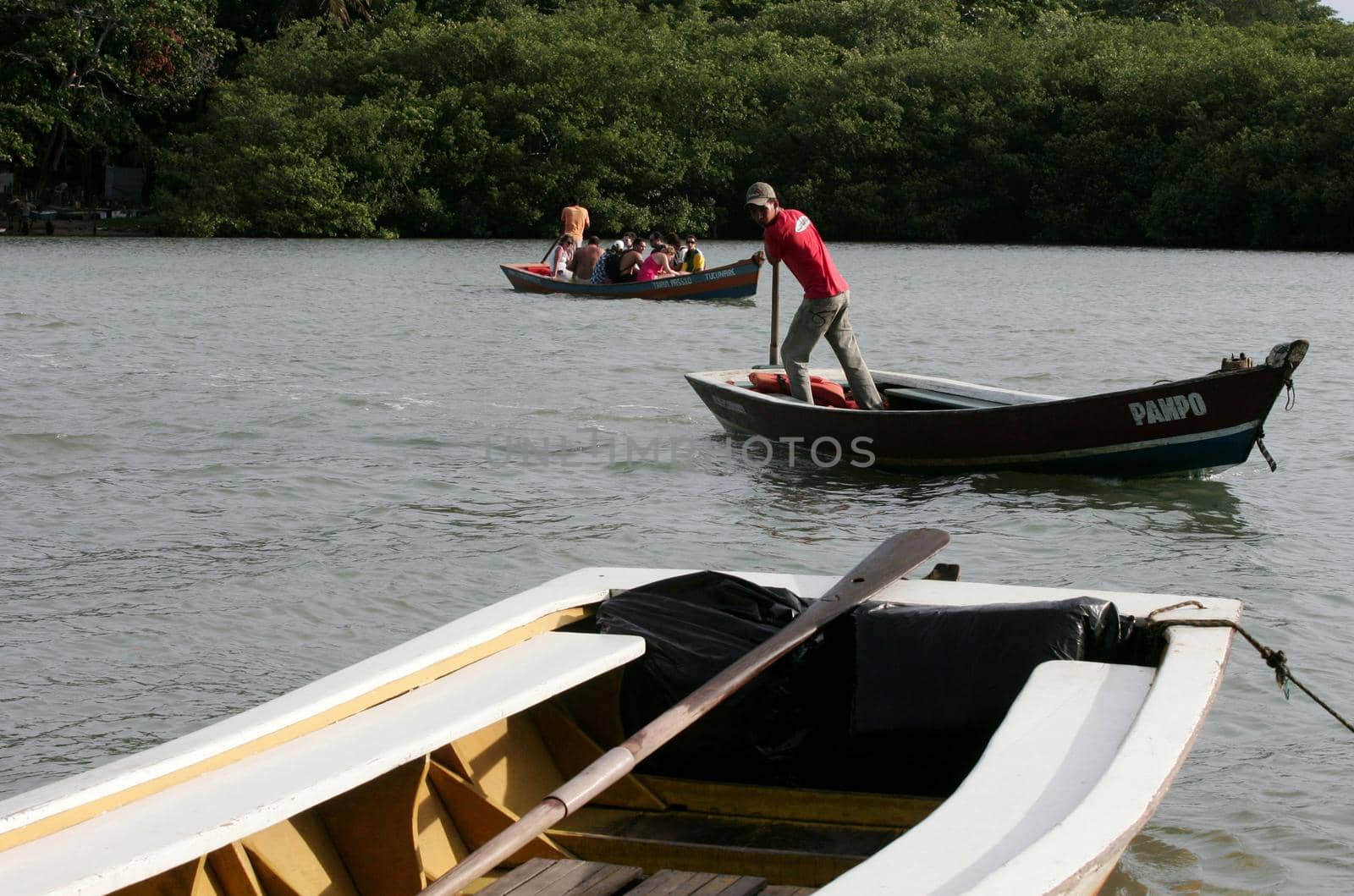 porto seguro, bahia / brazil - november 4, 2009: Tourist transport vessels are seen in the port of Rio Caraiva, Porto Seguro district.