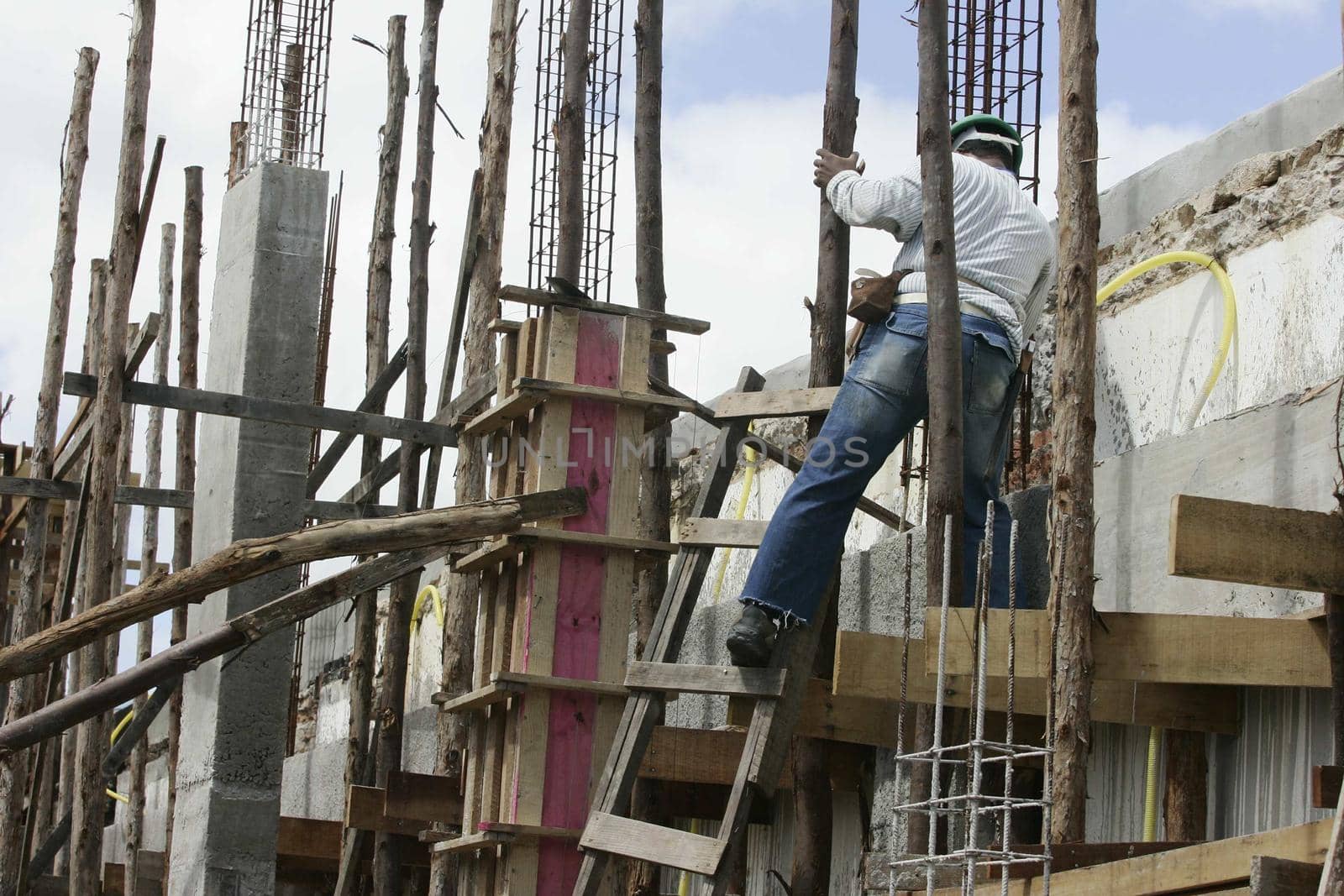 eunapolis, bahia / brazil - august 25, 2009: Construction workers are seen on construction site in the city of Eunapolis.
