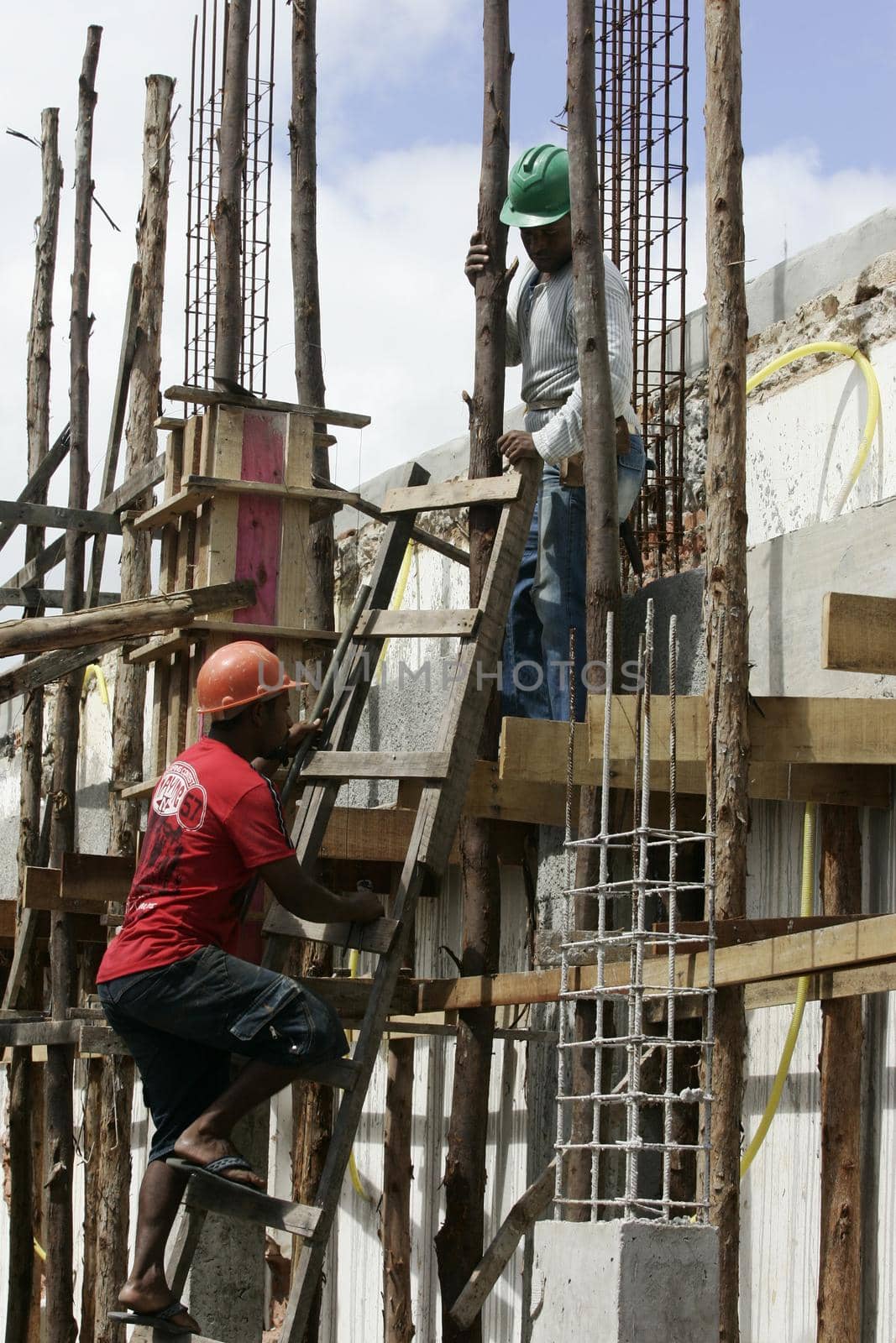 eunapolis, bahia, brazil - august 25, 2009: Construction workers working on construction of a building in the city of Eunapolis.
