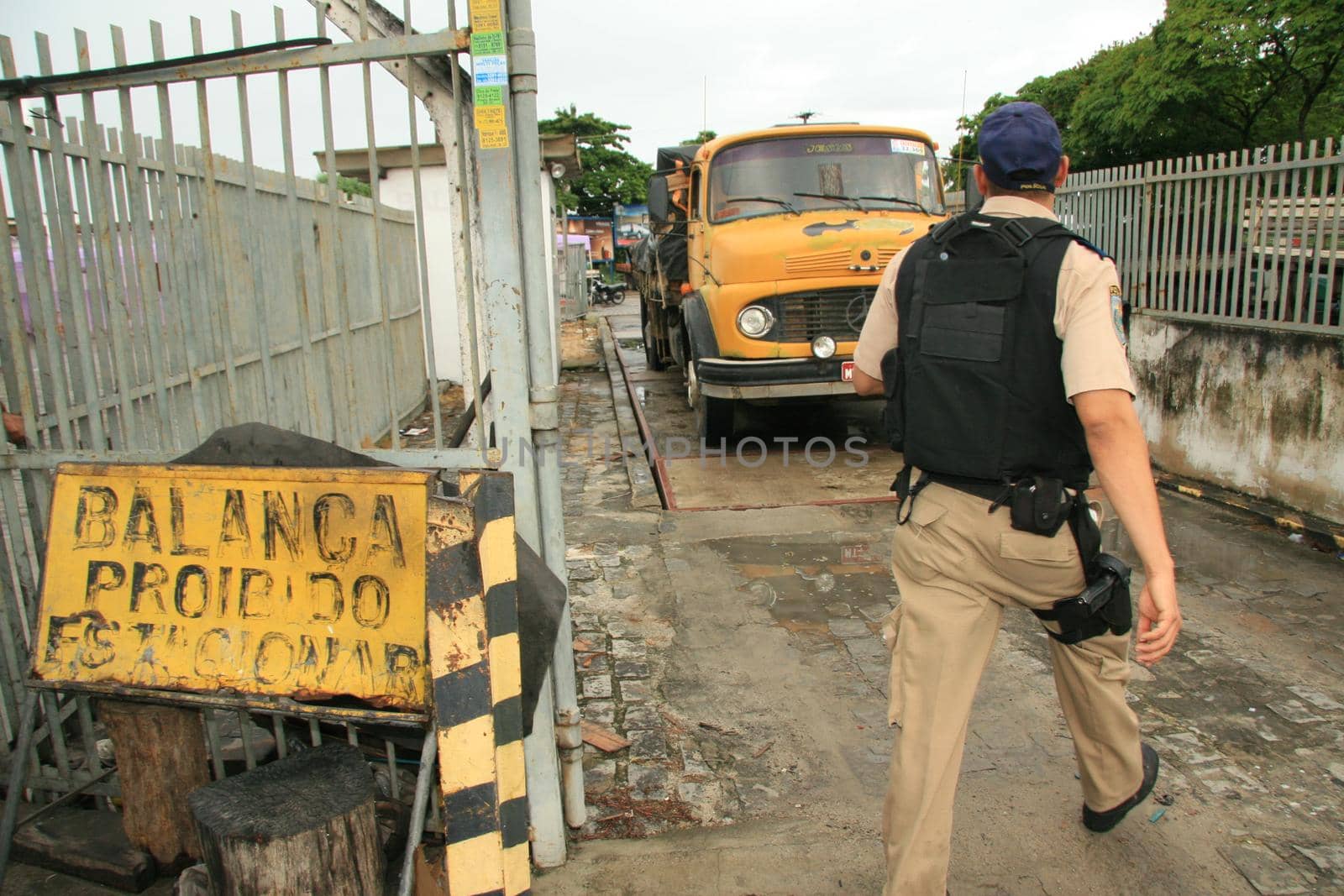 eunapolis, bahia / brazil - may 6, 2009: Federal Highway Police officer spotted during Operation on BR 101 Highway oversees overweight cargo vehicles.