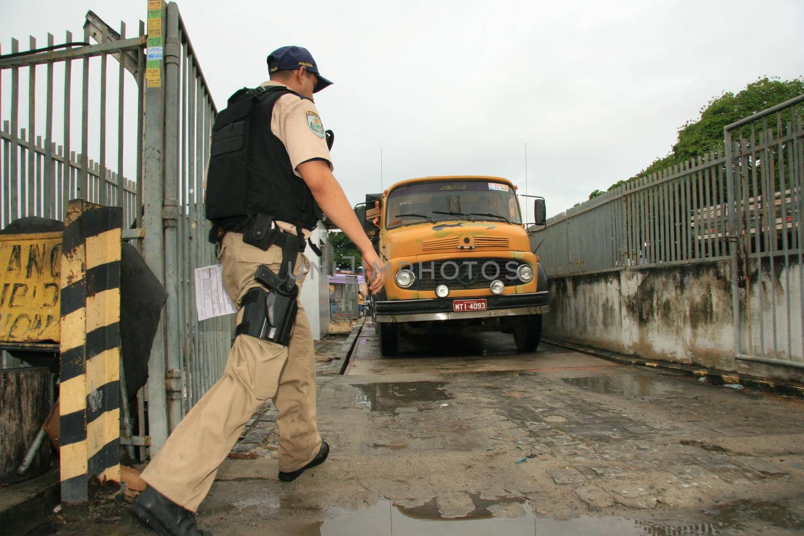 eunapolis, bahia / brazil - may 6, 2009: Federal Highway Police officer spotted during Operation on BR 101 Highway oversees overweight cargo vehicles.