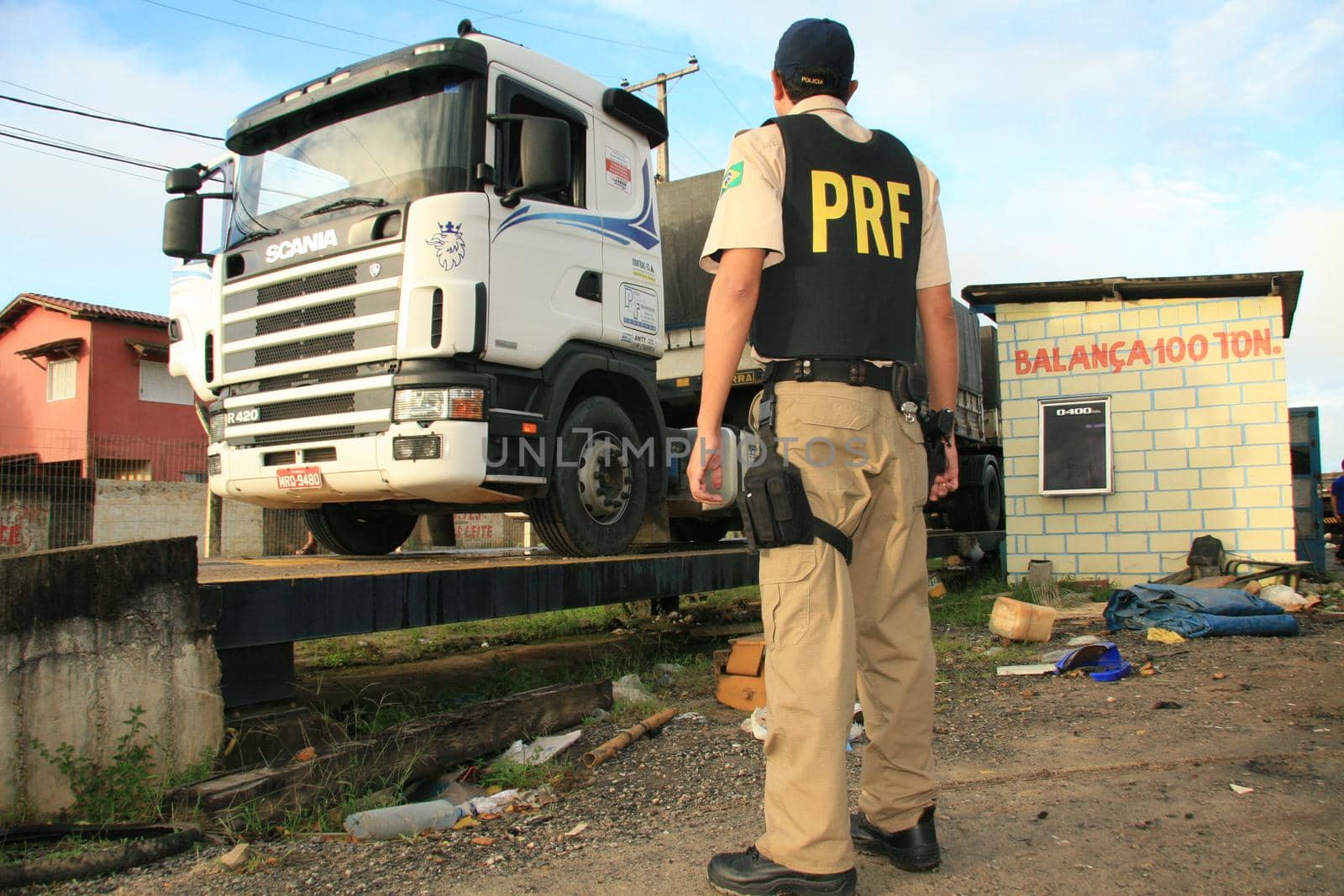 eunapolis, bahia / brazil - may 6, 2009: Federal Highway Police officer spotted during Operation on BR 101 Highway oversees overweight cargo vehicles.