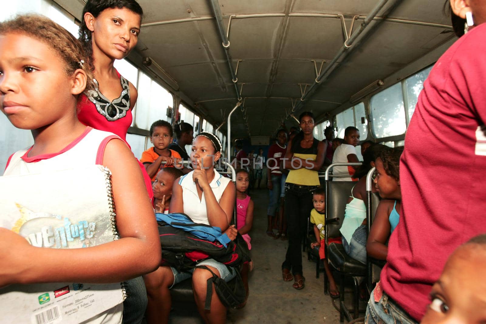 nova vicosa, bahia, brazil - december 3, 2009: children from the quilombola community Euvecia are seen on a school bus.