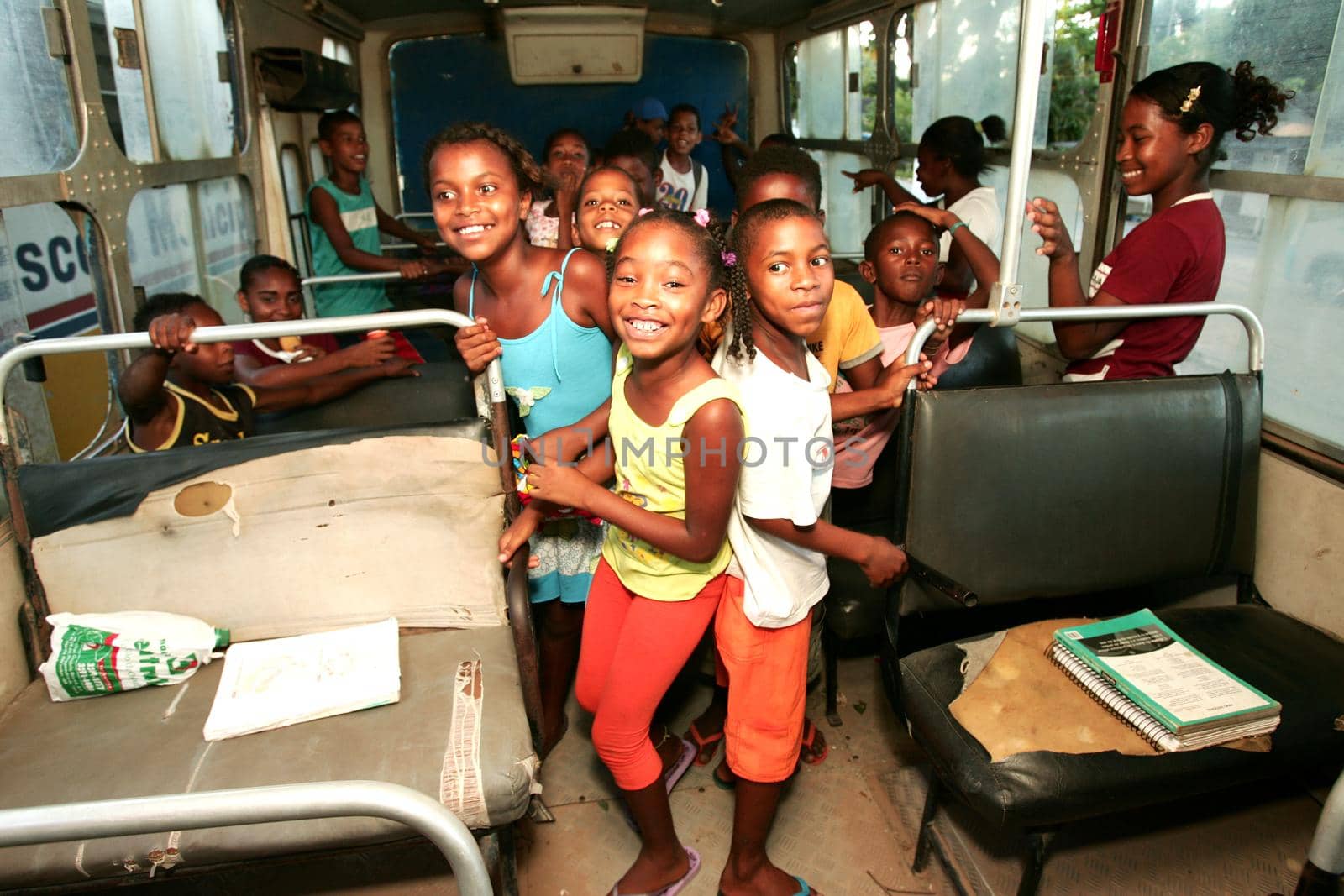 nova vicosa, bahia, brazil - december 3, 2009: children from the quilombola community Euvecia are seen on a school bus.