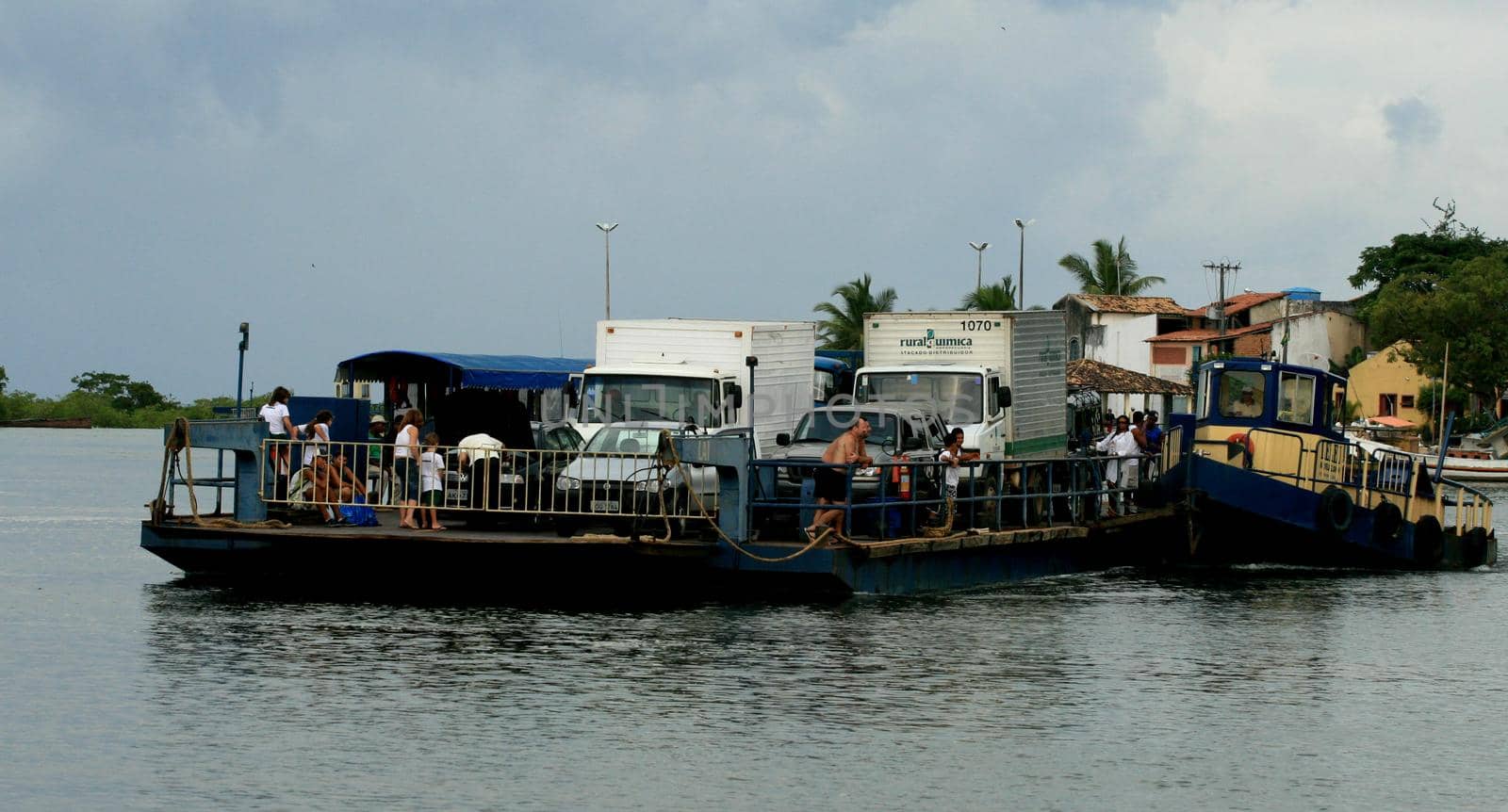 santa cruz cabralia, bahia / brazil - december 6, 2010: Ferry is seen as it crosses vehicles and people across the Joao de Tiba River, between Santa Cruz Cabralia municipality and Santo Andre district.

