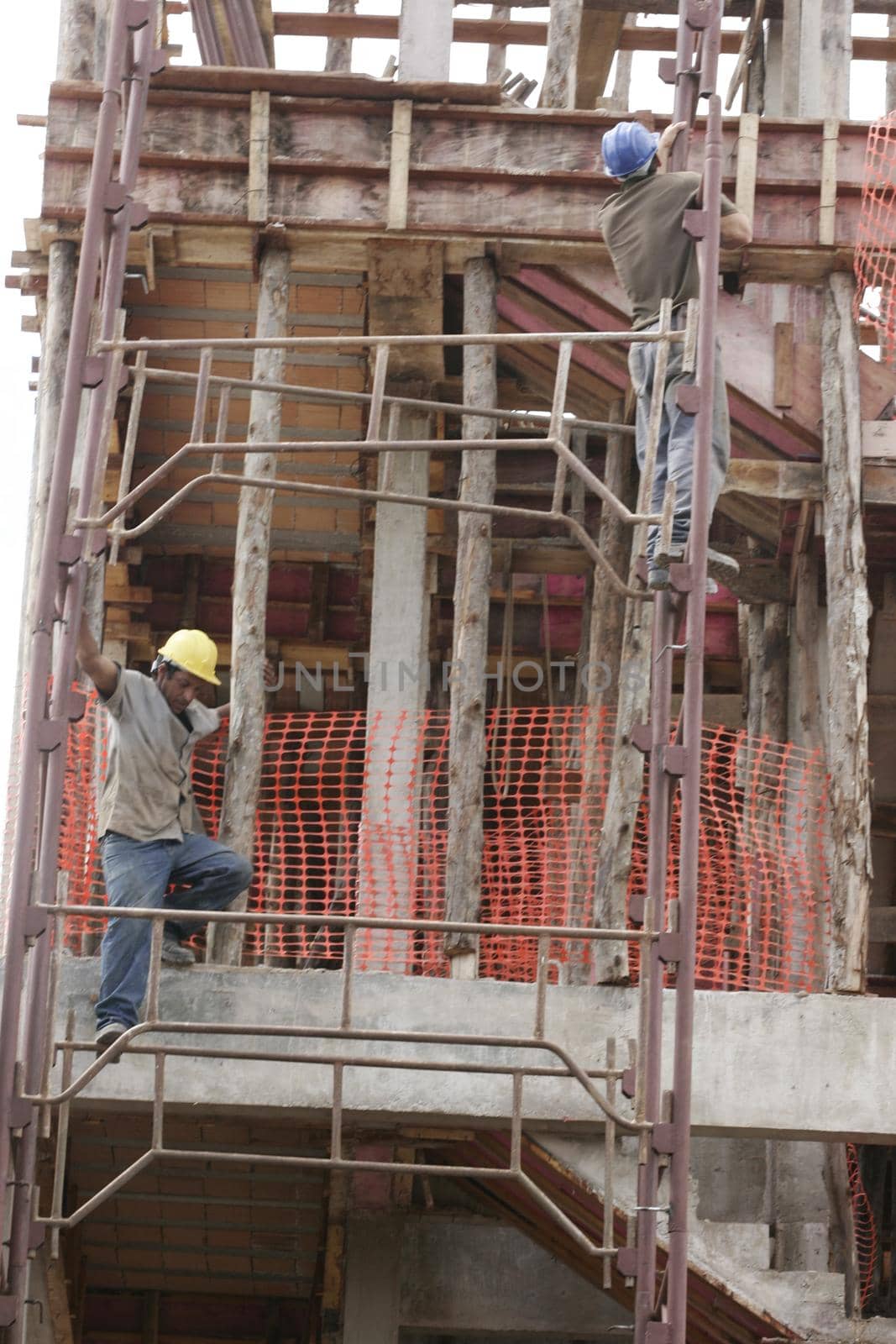 eunapolis, bahia, brazil - august 25, 2009: Construction workers working on construction of a building in the city of Eunapolis.