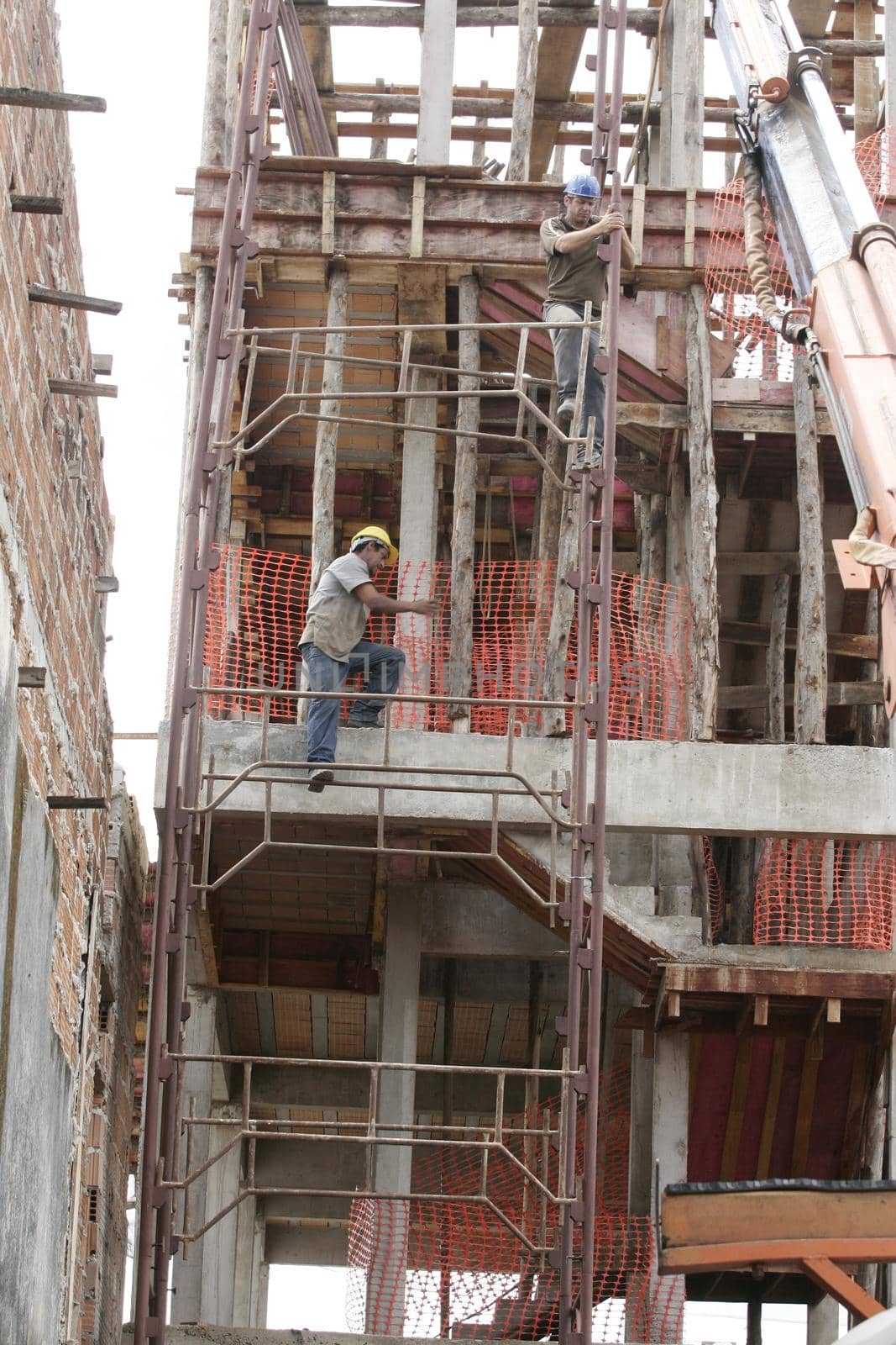 eunapolis, bahia, brazil - august 25, 2009: Construction workers working on construction of a building in the city of Eunapolis.