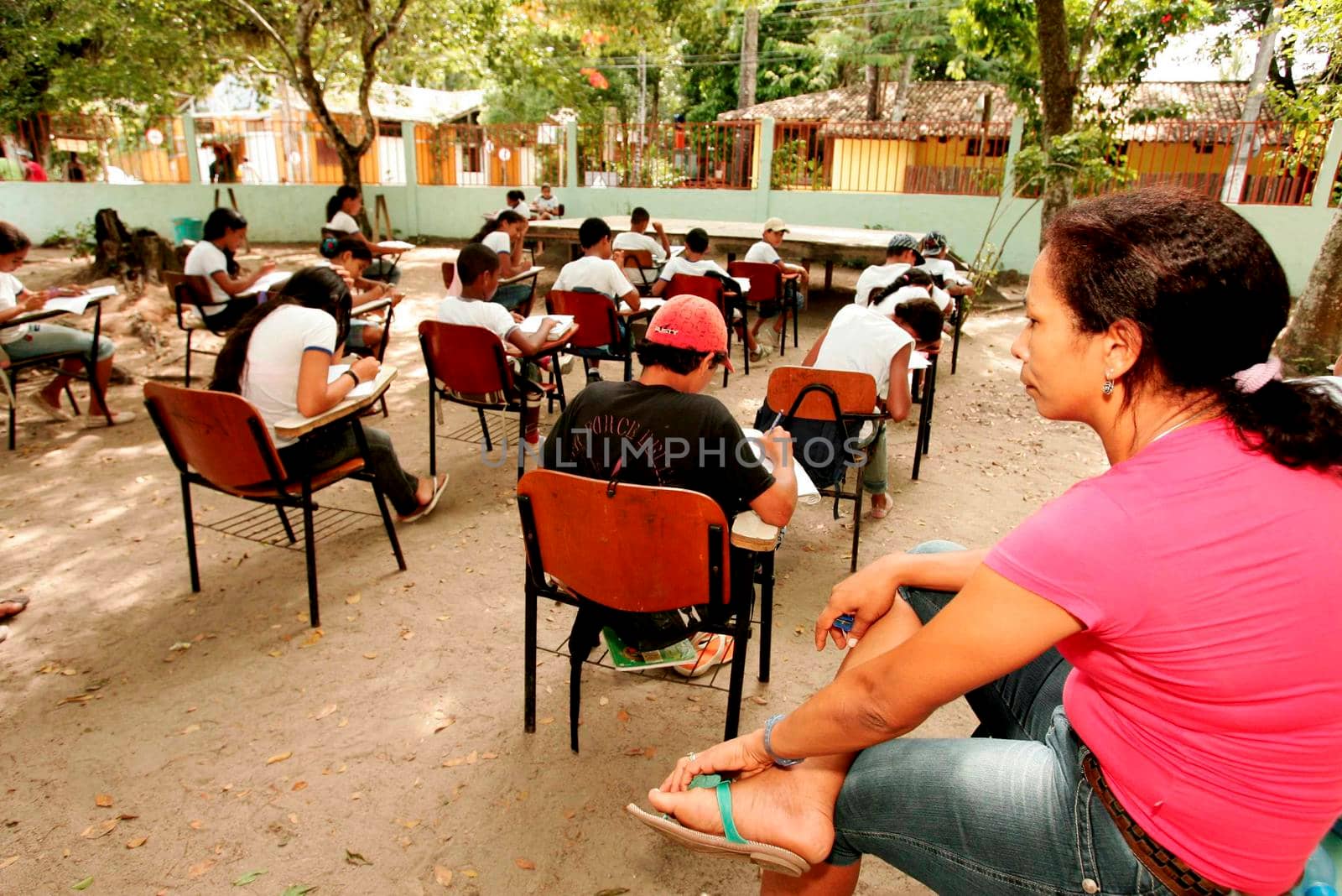 students attend class on the school patio by joasouza