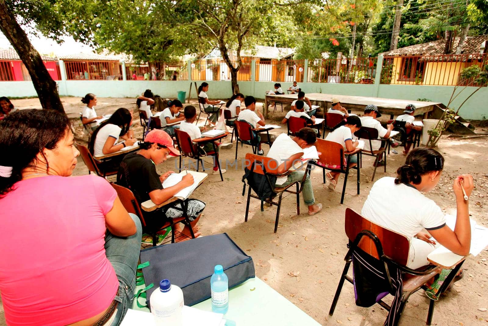 porto Seguro, bahia / brazil - january 20, 2009: public school students attend class on the school patio in the Trancoso district, municipality of Porto Seguro, in southern Bahia.