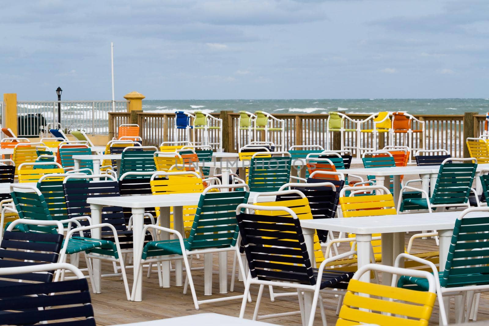 Empty patio with multi color chair.