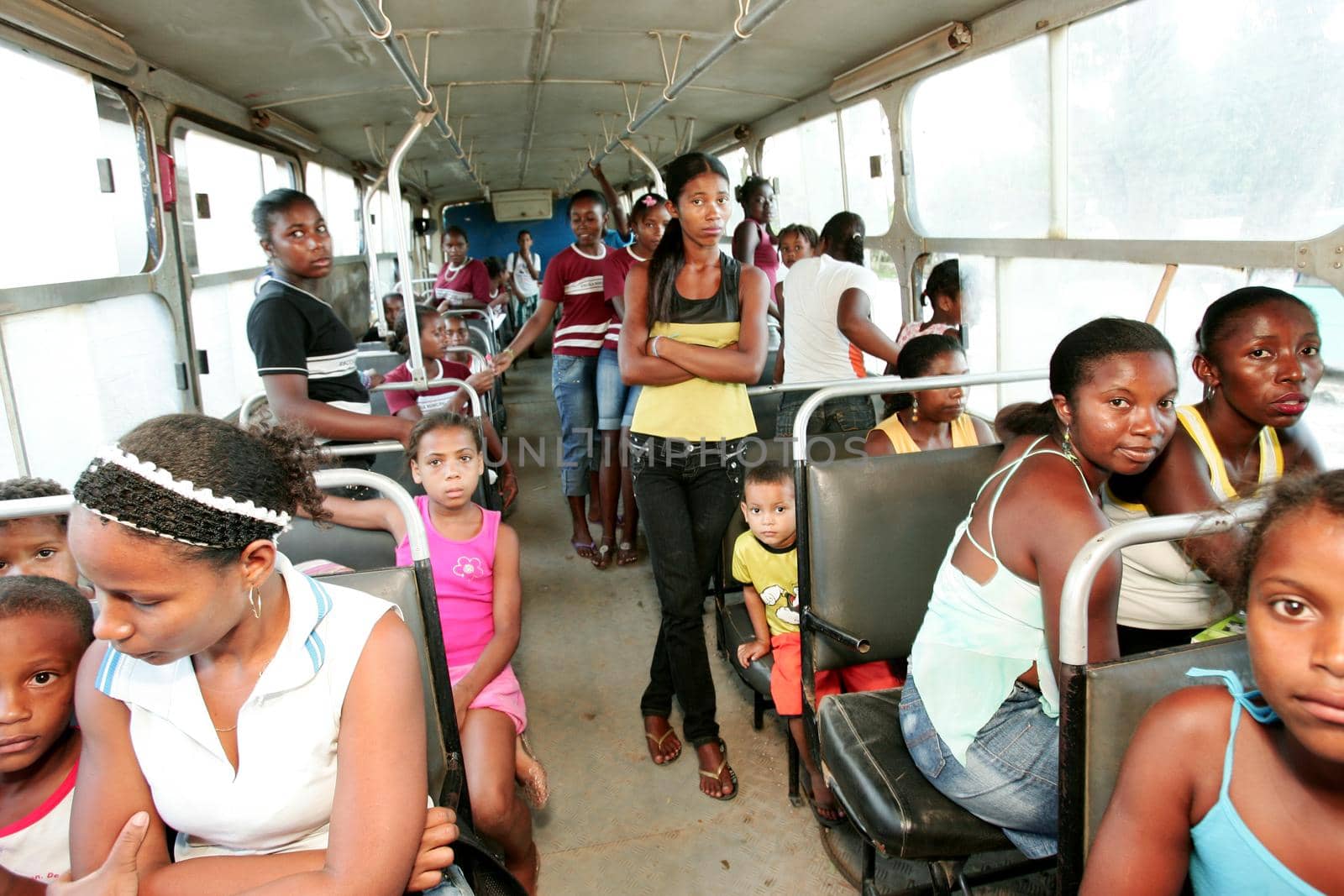nova vicosa, bahia, brazil - december 3, 2009: children from the quilombola community Euvecia are seen on a school bus.