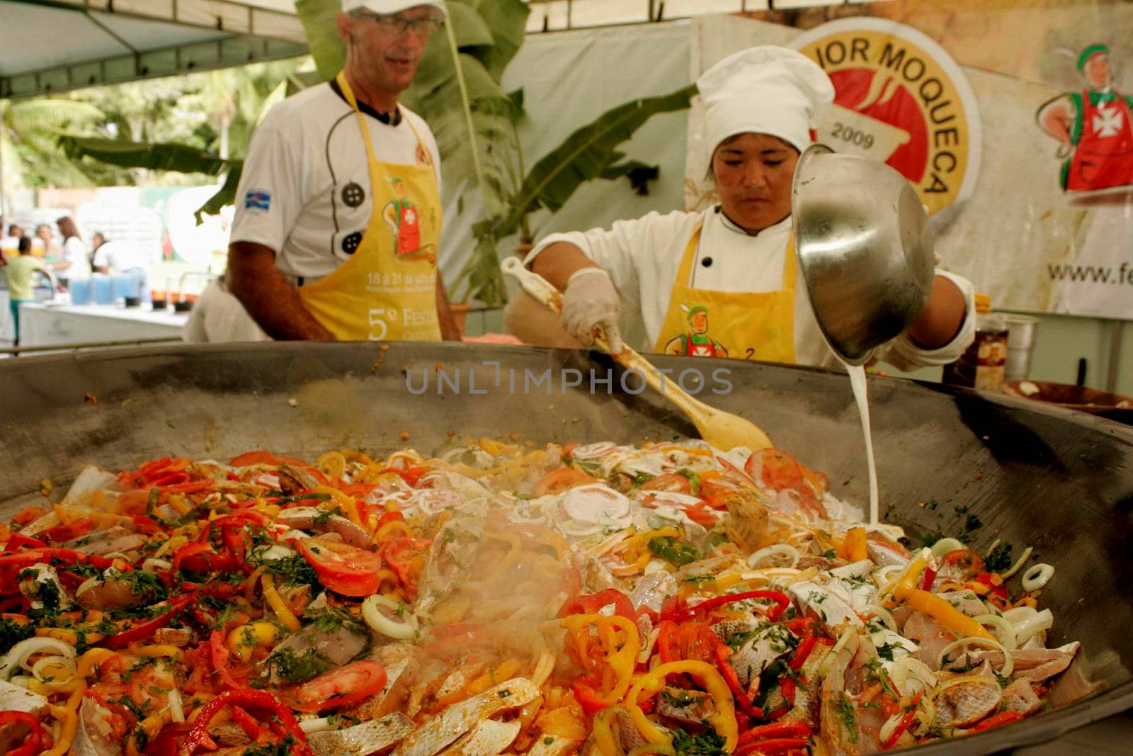 belmonte, bahia / brazil - july 19, 2009: chief cook prepares a giant fish stew in the city of Belmonte, in the south of Bahia.