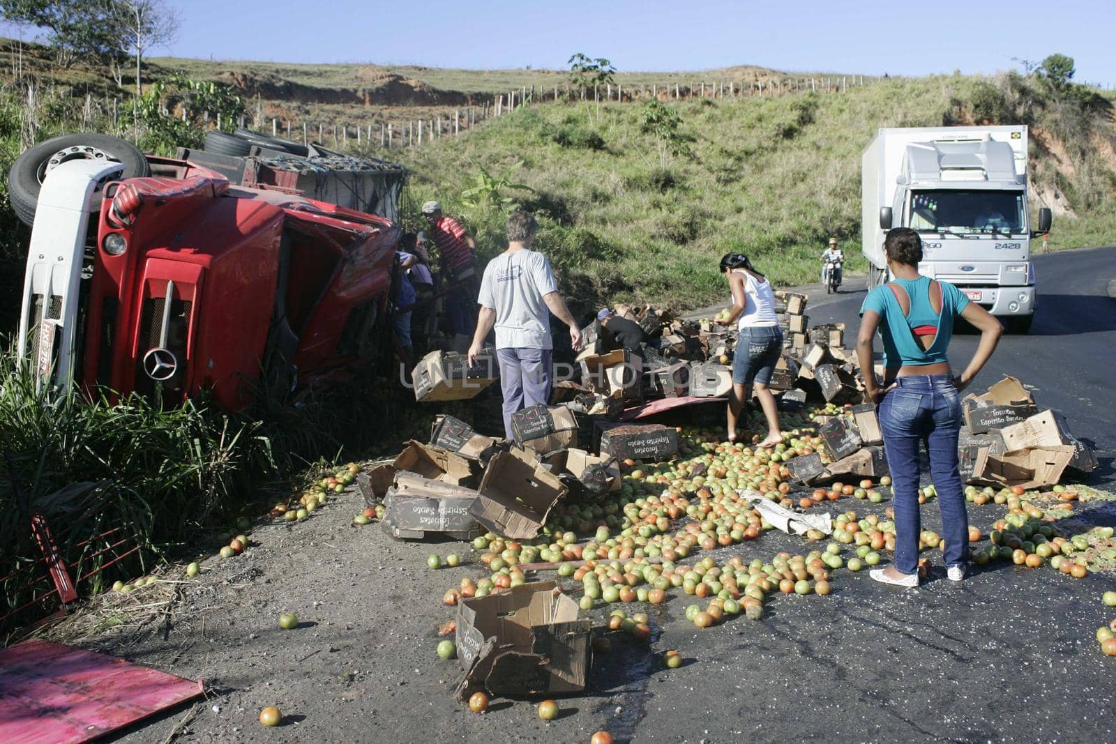 teixeira de freitas, bahia / brazil - july 28, 2018: truck involved in accident has its cargo looted on highway BR 101, in Teixeira de Freitas.