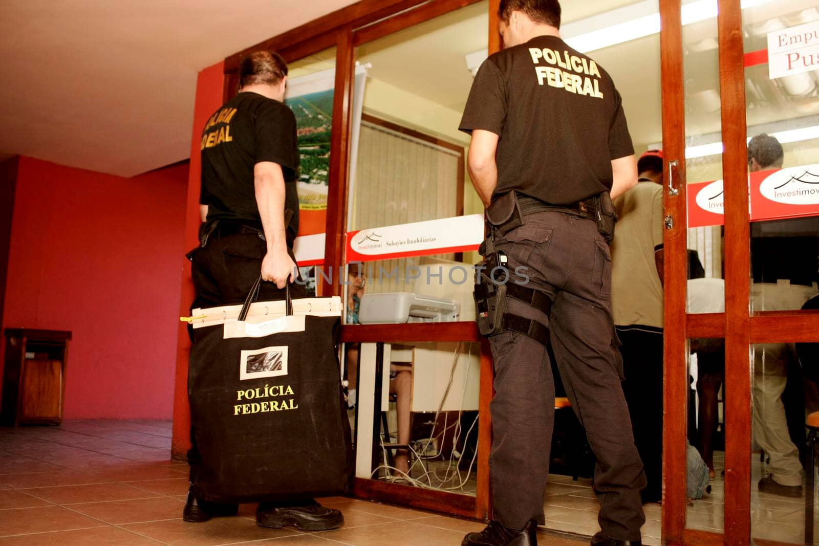 porto seguro, bahia / brazil - august 6, 2009: Federal Police agents are seen during an investigation operation in the city of Porto Seguro, in the south of Bahia.