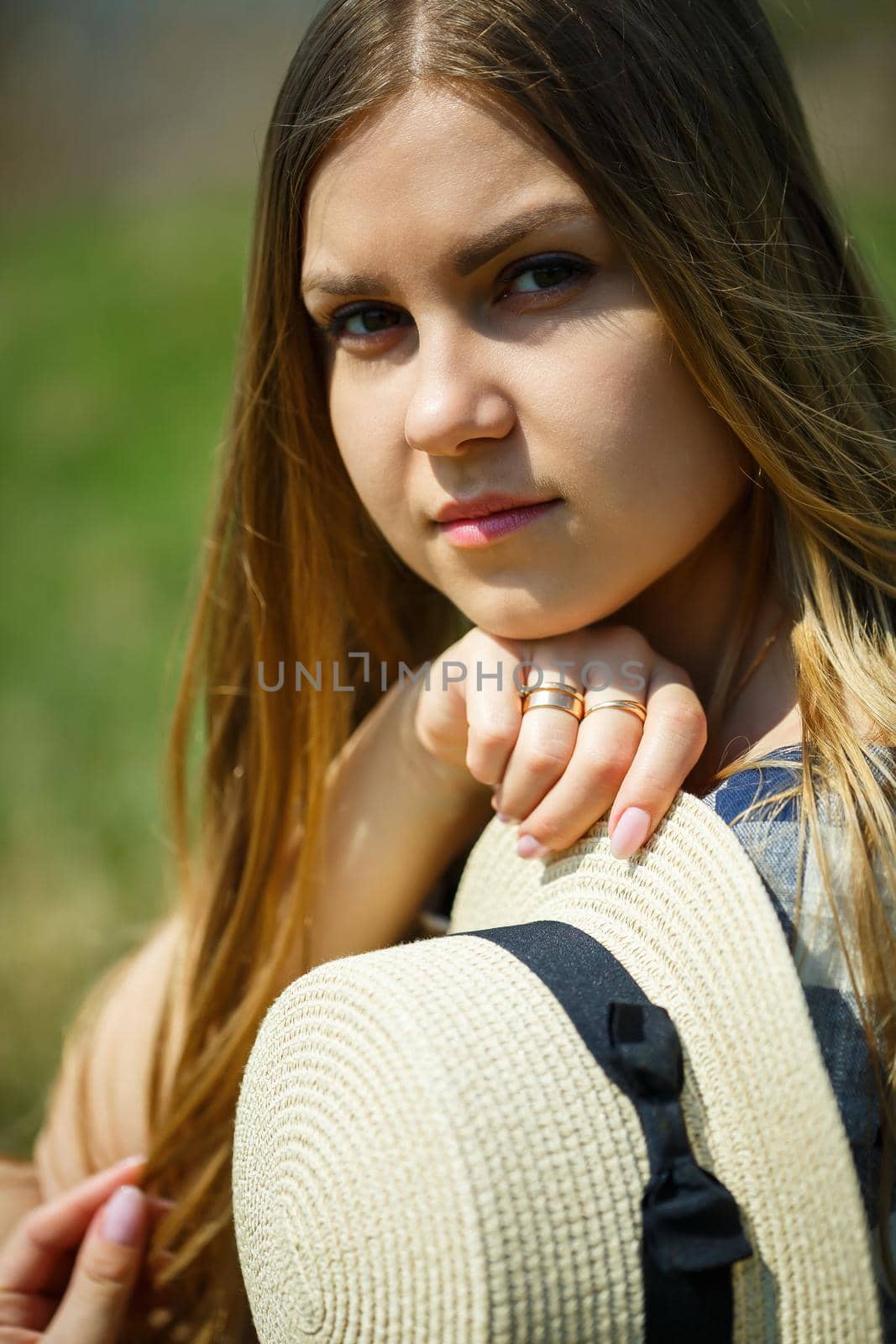 beautiful girl in a dress walking in the spring forest where the trees bloom