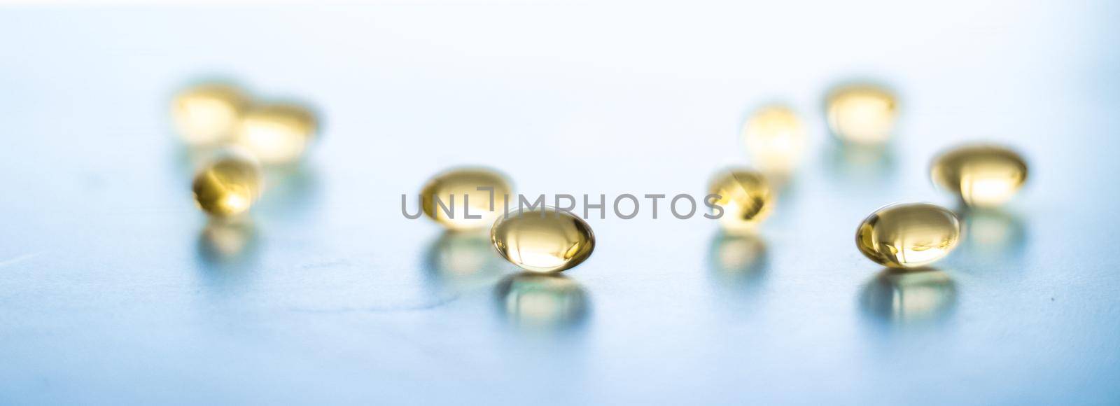 Pharmaceutical, branding and science concept - Vitamin D and golden Omega 3 pills for healthy diet nutrition, fish oil food supplement pill capsules, healthcare and medicine as pharmacy background