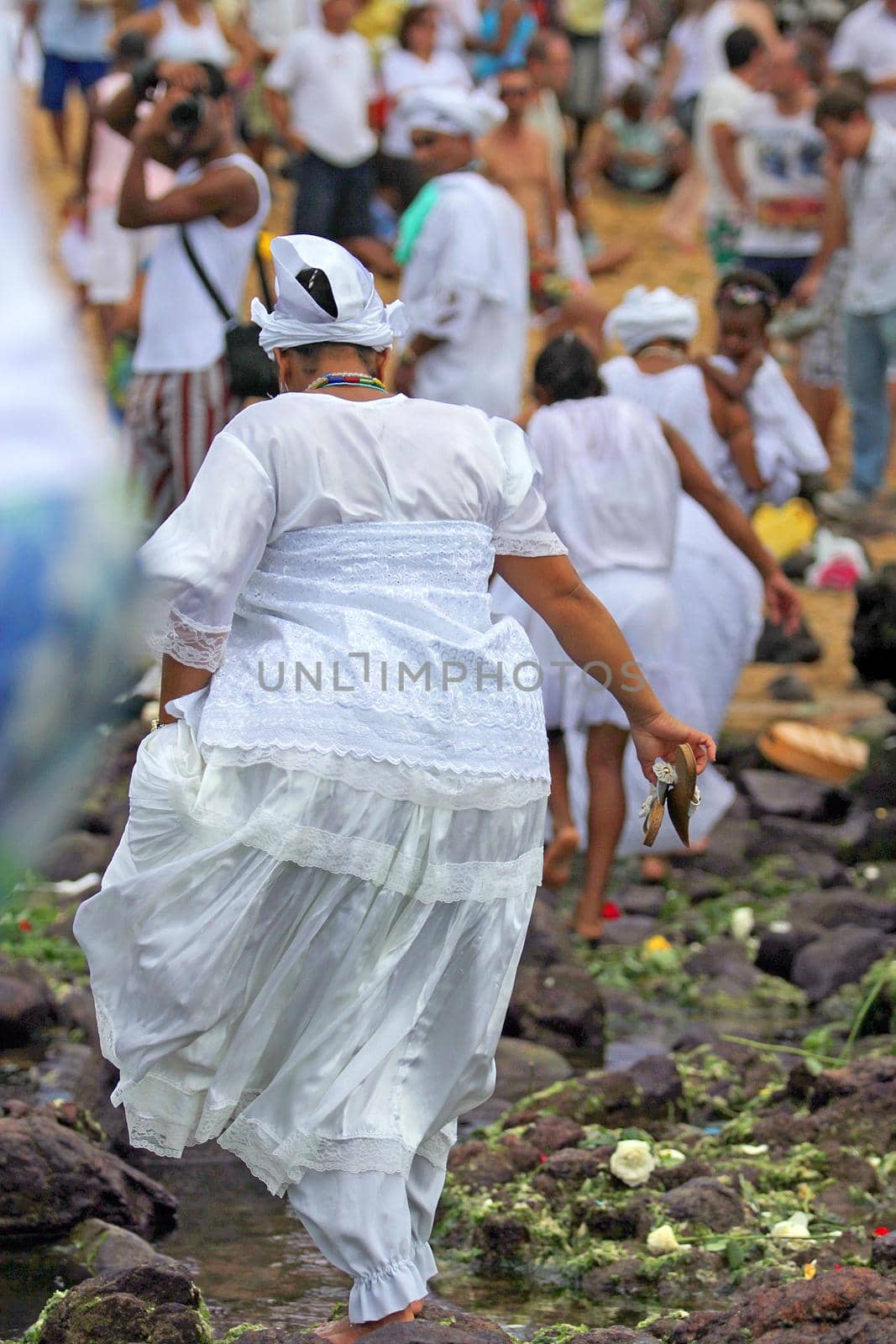 salvador, bahia, brazil - february 2, 2014: Integrants of the Candomble religion are seen during celebrations in honor of Orixa Yemanja on a beach in the city of Salvador.