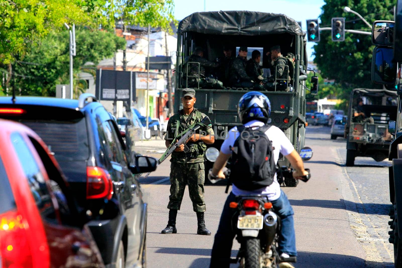 buerarema, bahia, brazil - february 14, 2014: Brazilian army soldiers patrol the streets of the city of Buerarema, during agrarian conflicts with Tupinamba Indians.
