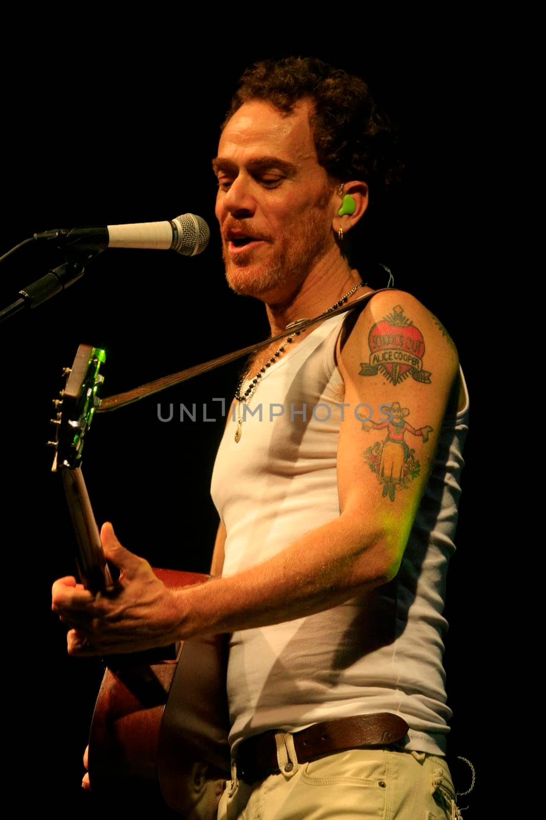 cairu, bahia, brazil - november 14, 2013: singer Nando Reis and his band during Spring Festival in Morro de Sao Paulo.