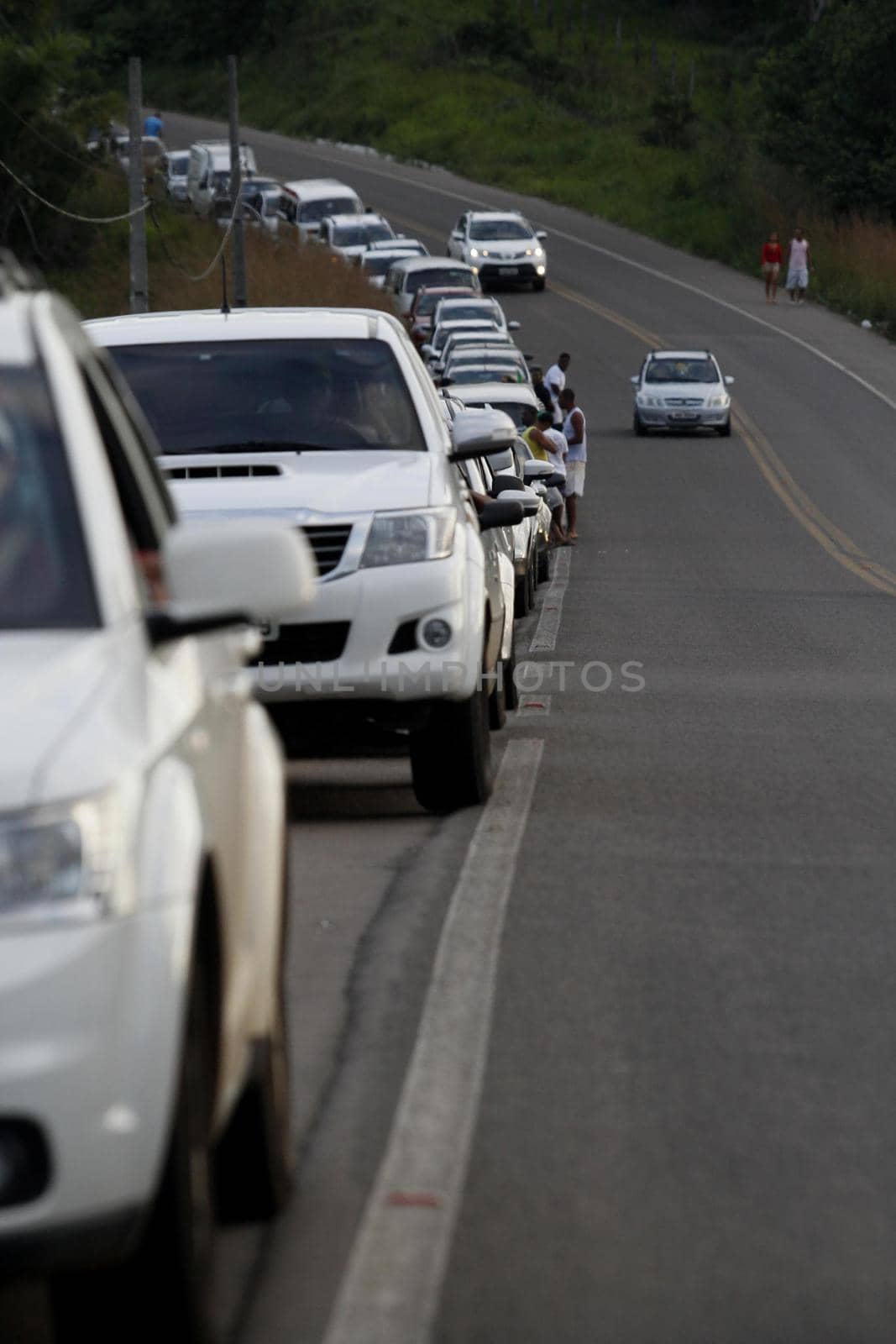 itaparica, bahia, brazil - june 24, 2014: vehicles queued to access the Ferry Boat system on the island of Itaparica bound for the city of Salvador.