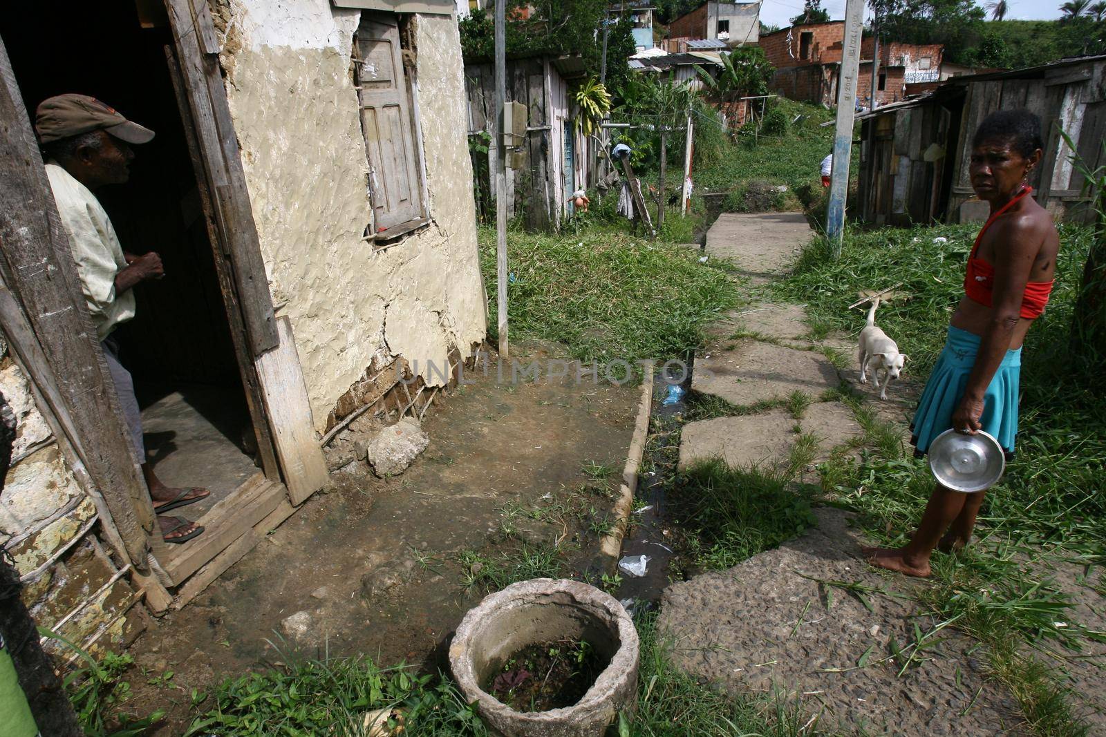 itabuna, bahia, brazil - january 5, 2012: open sewer next to a makeshift wooden house in a favela area in the city of Itabuna.