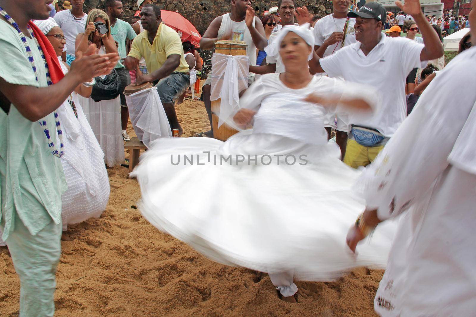 salvador, bahia, brazil - february 2, 2014: Integrants of the Candomble religion are seen during celebrations in honor of Orixa Yemanja on a beach in the city of Salvador.