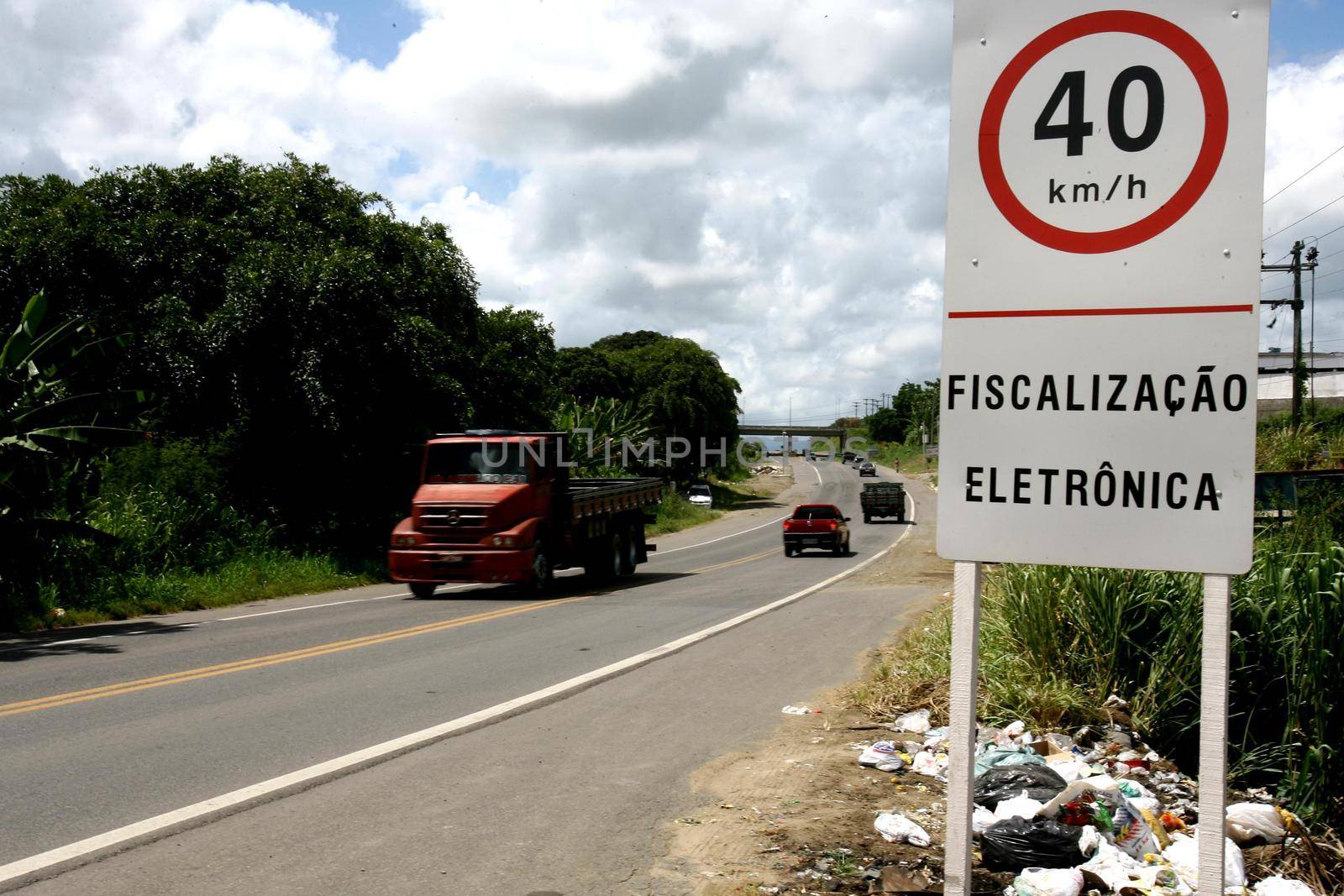 itabuna, bahia, brazil - january 13, 2012: traffic signs indicate speed limit to 40 kilometers per hour on federal highway BR 101 in the city.