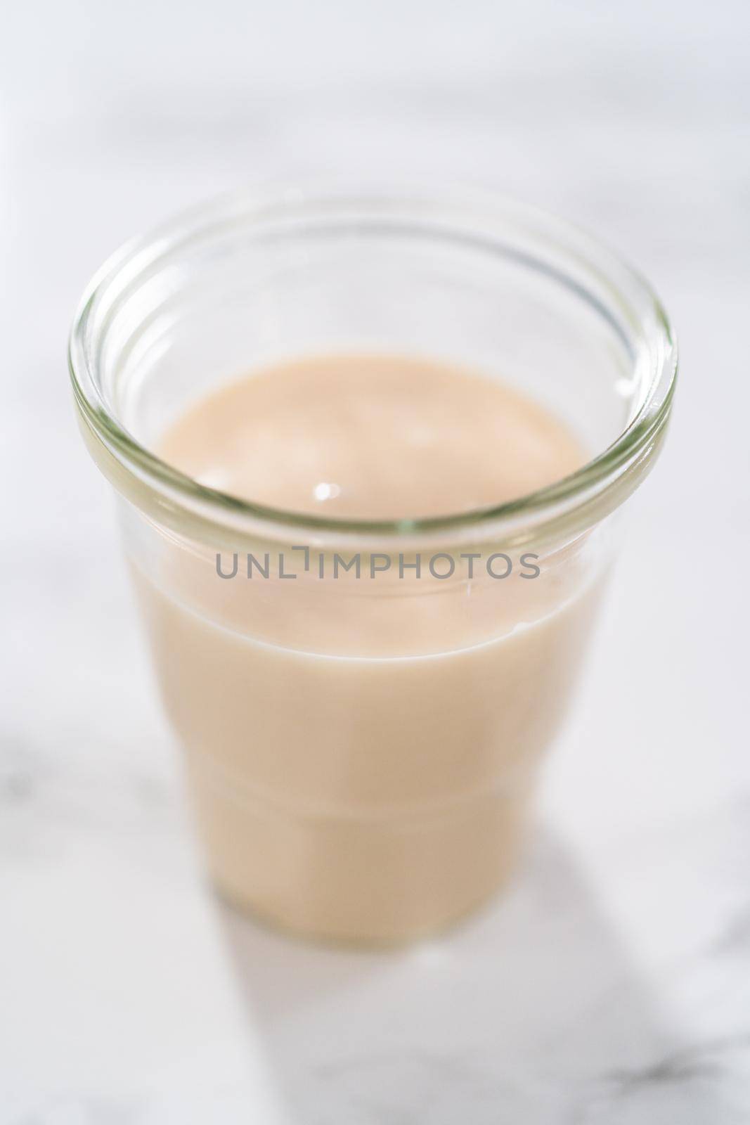 Lemon glaze. Lemon glaze in a glass jar.