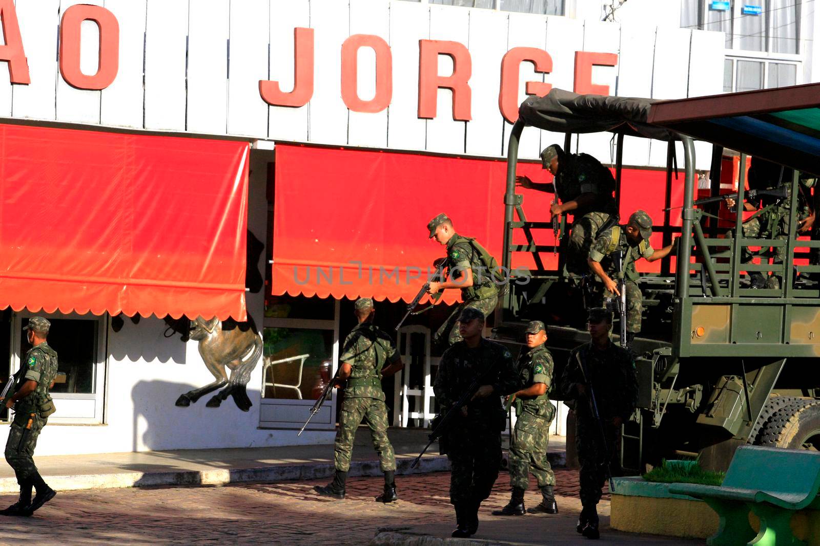 buerarema, bahia, brazil - february 14, 2014: Brazilian army soldiers patrol the streets of the city of Buerarema, during agrarian conflicts with Tupinamba Indians.