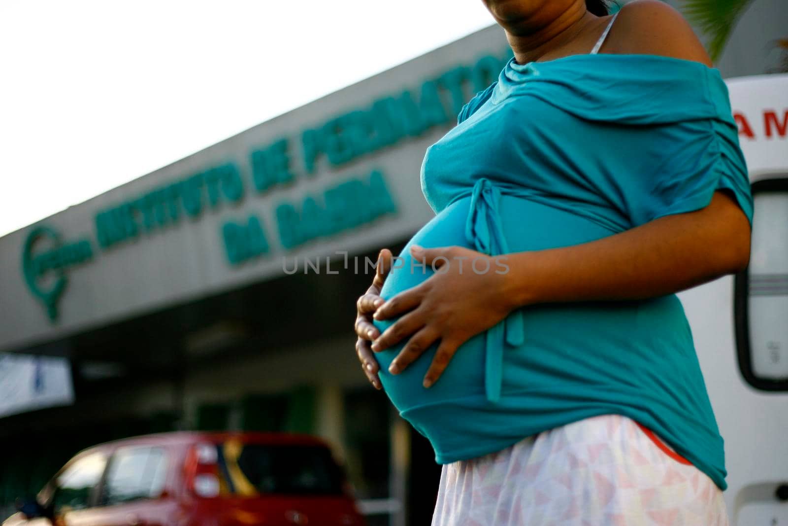 salvador, bahia, brazil - august 8, 2014: A pregnant woman is seen in front of the Iperba maternity hospital in the city of Salvador.