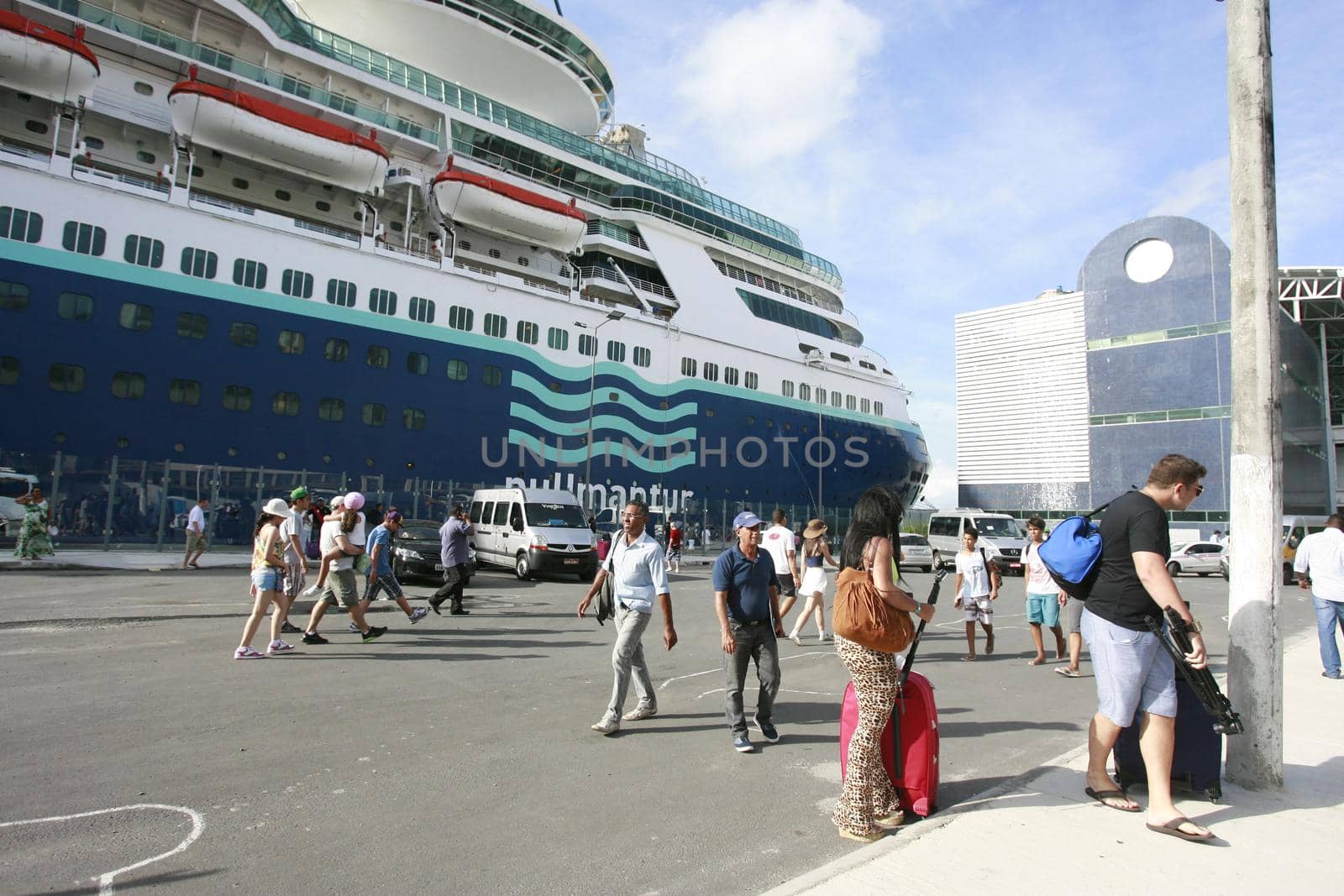 salvador, bahia, brazil - december 23, 2014: passengers during disembarkation from a transatlantic ship at the Maritime Terminal of Porto in the city of Salvador.
