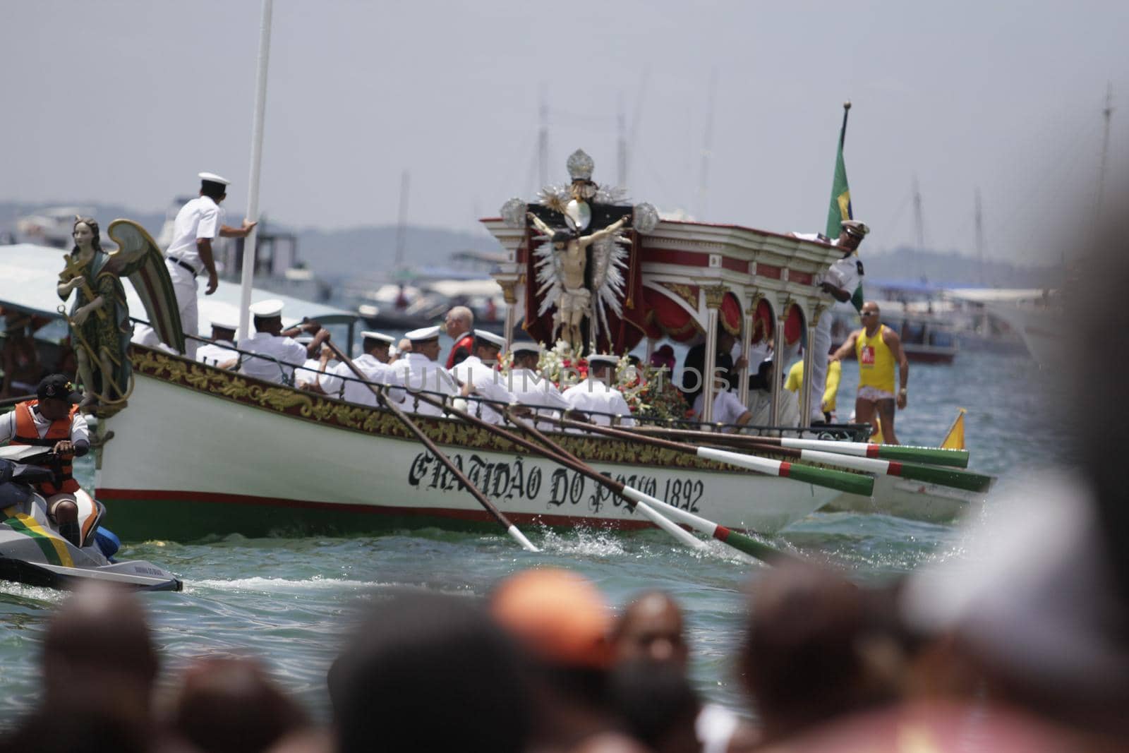 salvador, bahia, brazil - january 1, 2015: image of Bom Jesus dos Navegantes being carried by devotees on Boa Viagem beach after crossing the sea at Baia de Todos os Santos in Salvador.