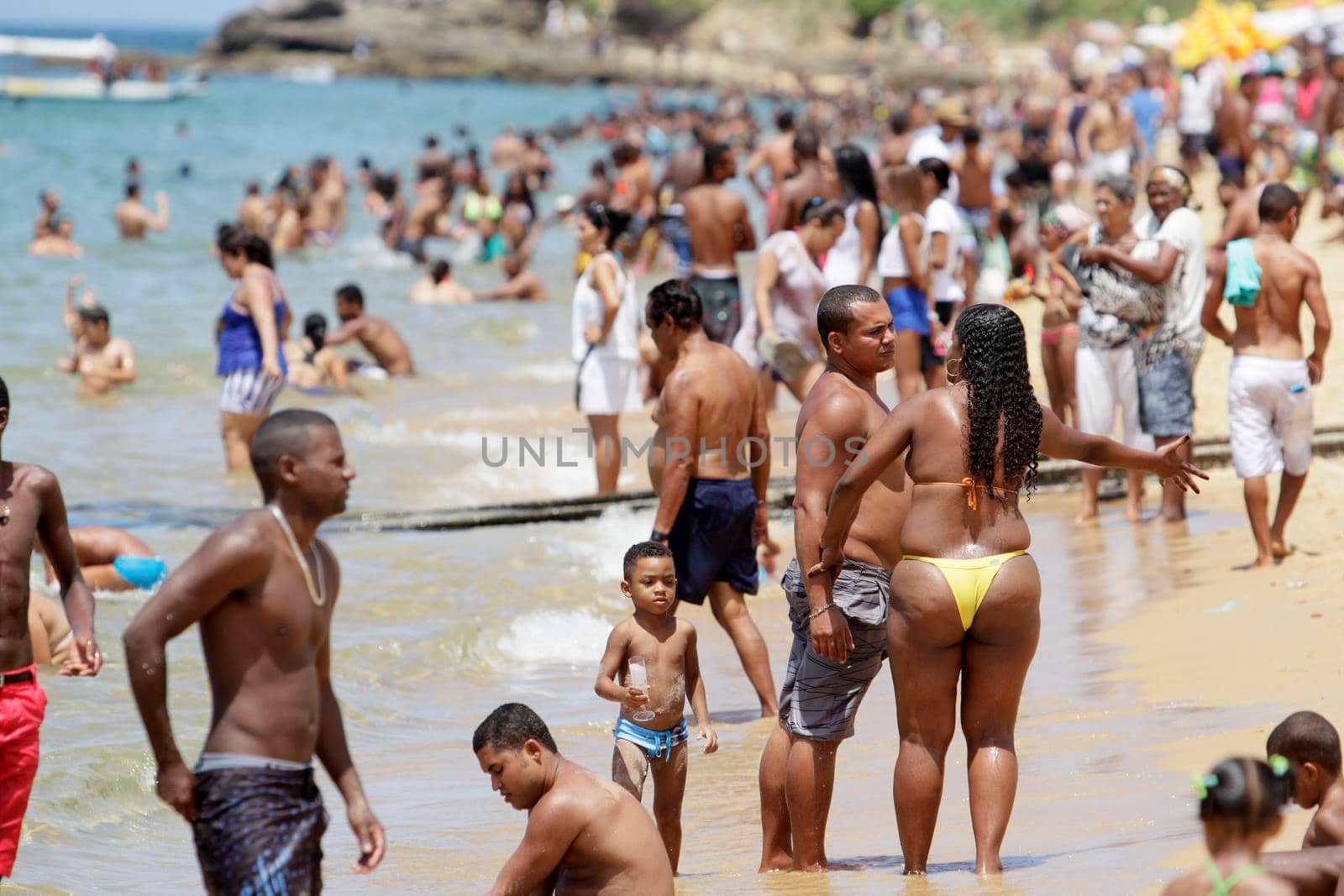 salvador, bahia / brazil - january 1, 2015: people are seen bathing on the Boa Viagem beach in the city of Salvador.