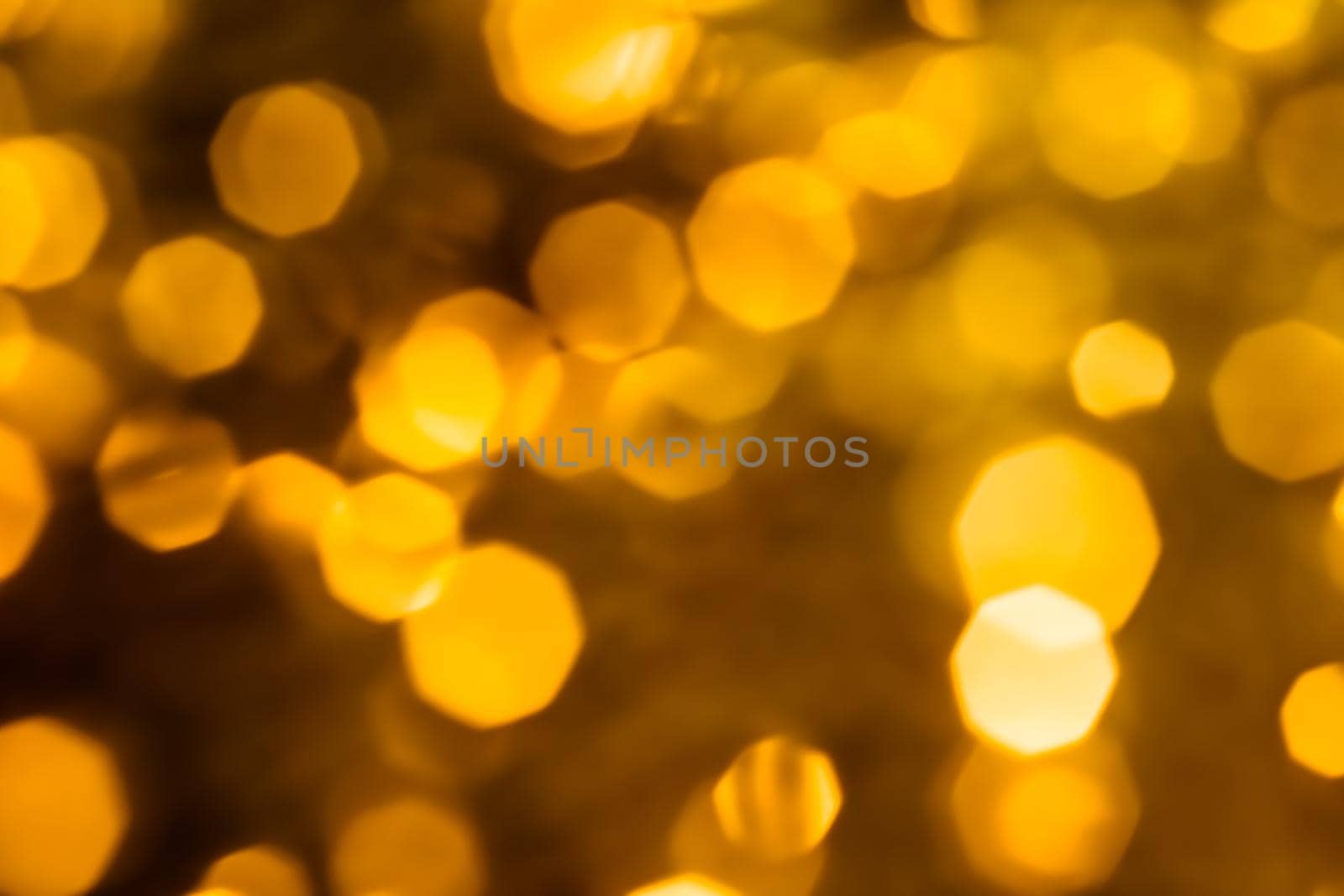 Golden Christmas lights, New Years Eve fireworks and abstract texture concept - Glamorous gold shiny glow and glitter, luxury holiday background