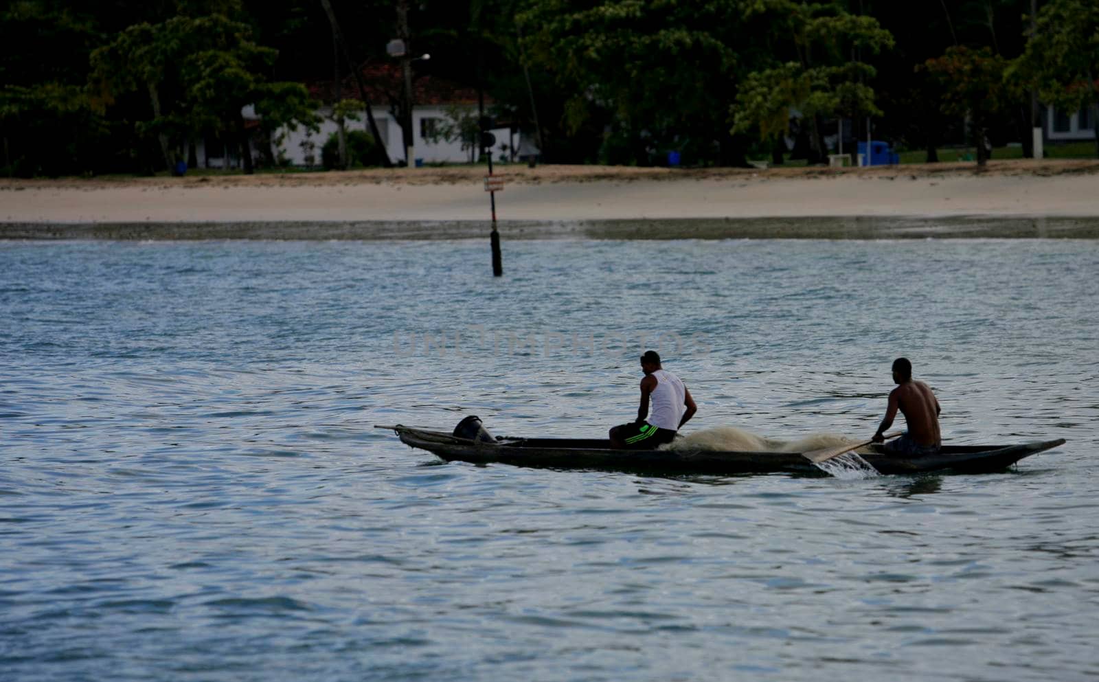 salvador, bahia / brazil - june 5, 2015: fishermen's canoe is seen on Sao Tome de Paripe beach, suburb of Salvador.
