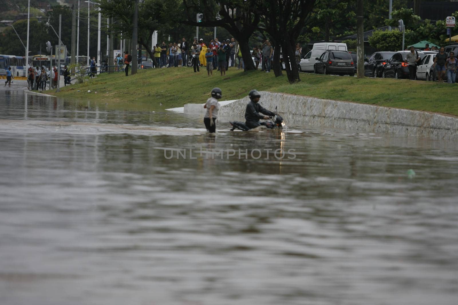 salvador, bahia, brazil - april 9, 2015: vehicle is seen on a street flooded due to rain in Salvador city.