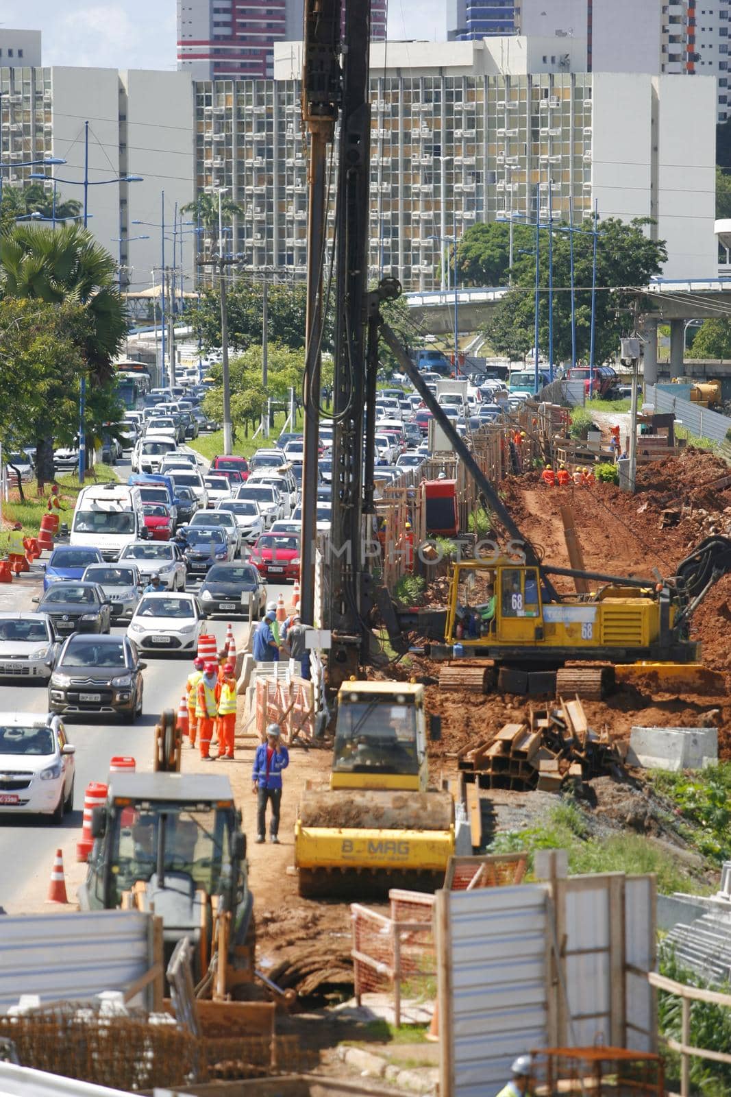 salvador, bahia / brazil - may 6, 2015: Workers work together to traffic vehicles on Avenida Antonio Carlos Magalhaes in works to expand the subway of Salvador.