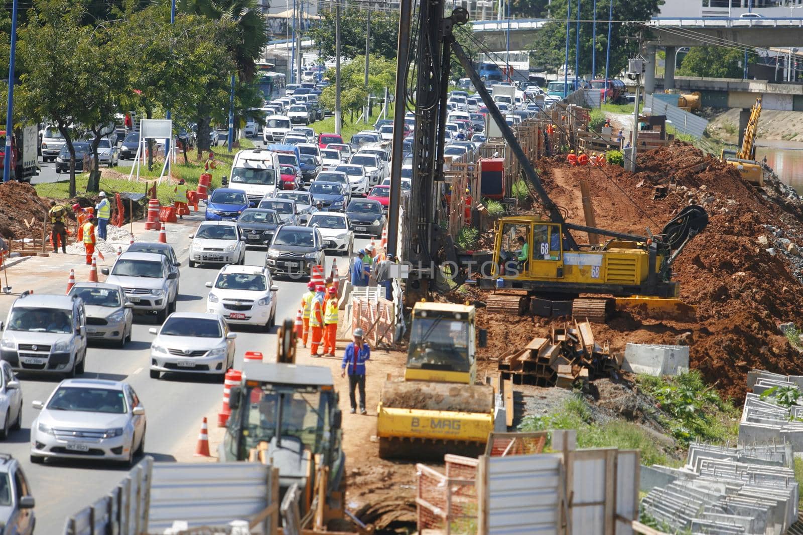 salvador, bahia / brazil - may 6, 2015: Workers work together to traffic vehicles on Avenida Antonio Carlos Magalhaes in works to expand the subway of Salvador.