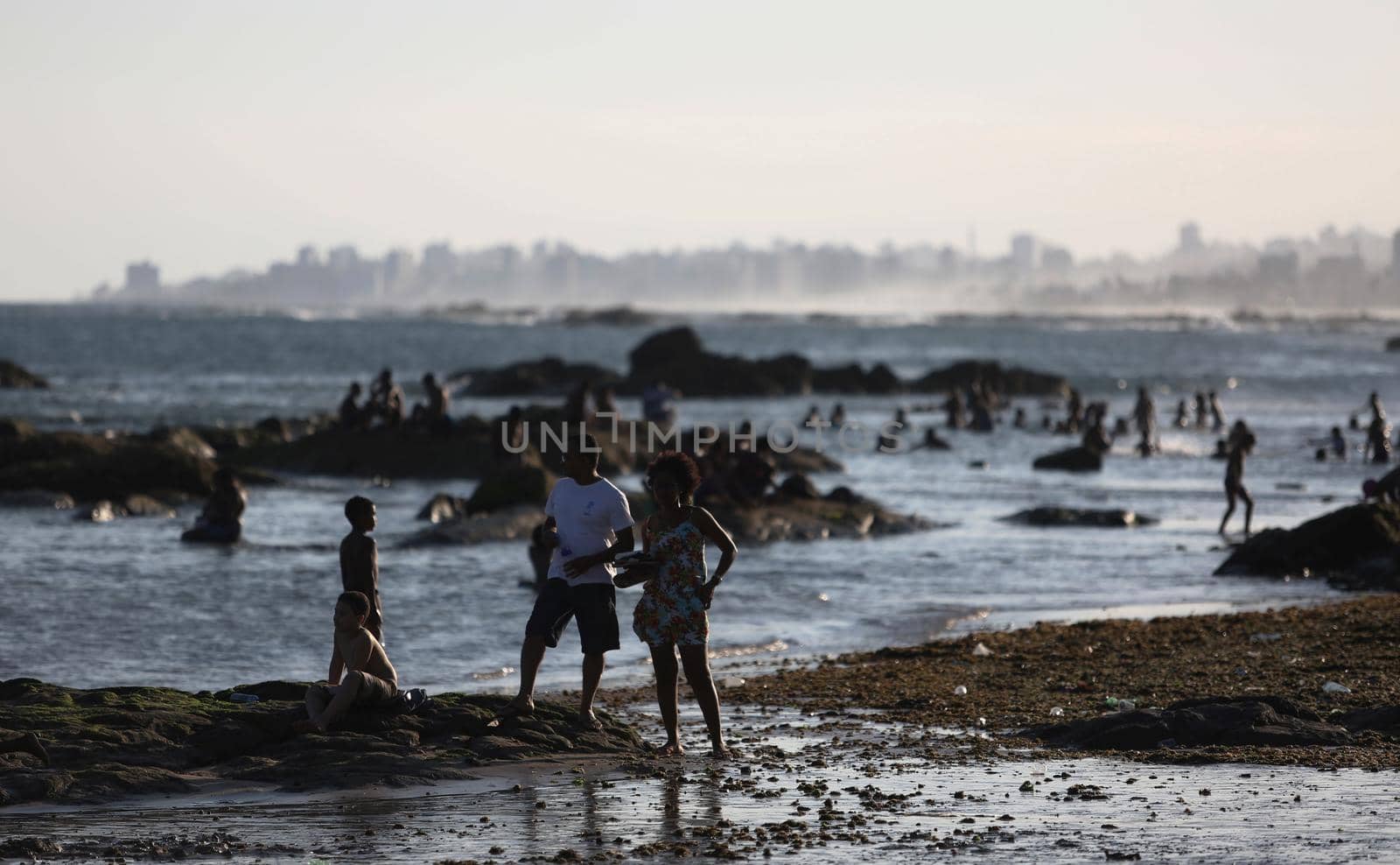 salvador, bahia / brazil - september 6, 2015: People are seen on rocks of Itapua Beach in Salvador.