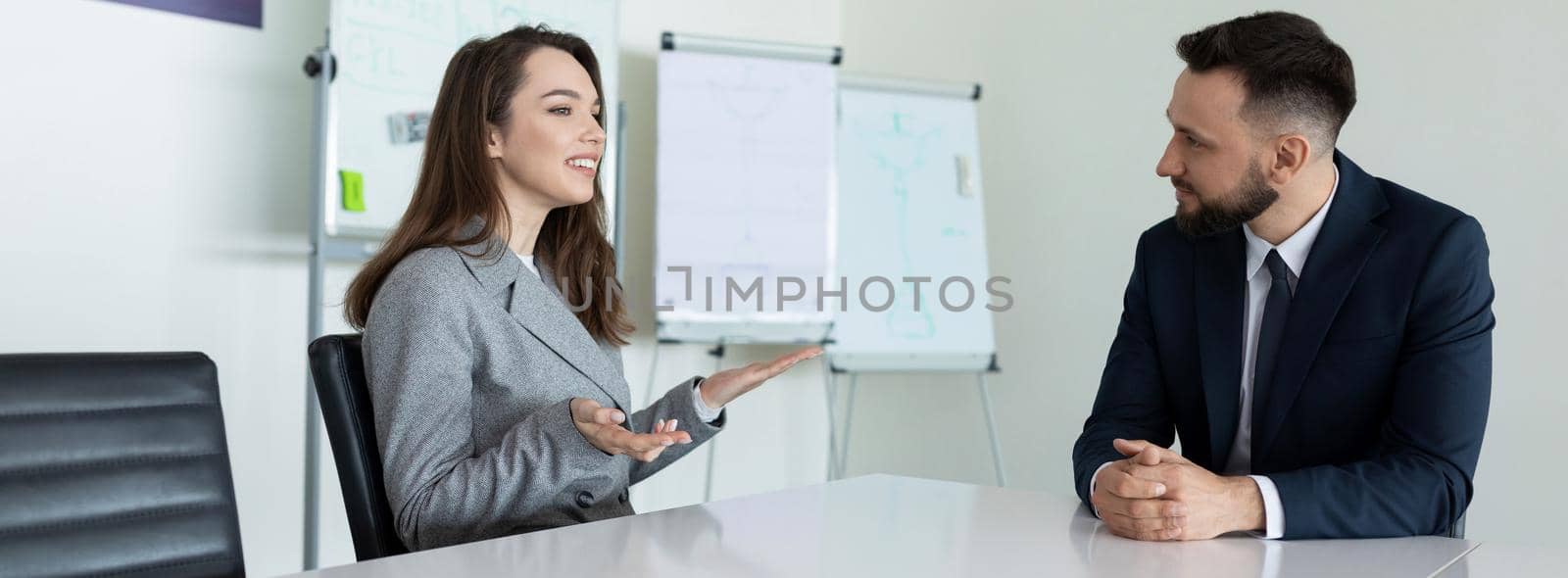 presentation of an employee at an interview in the office at the table.