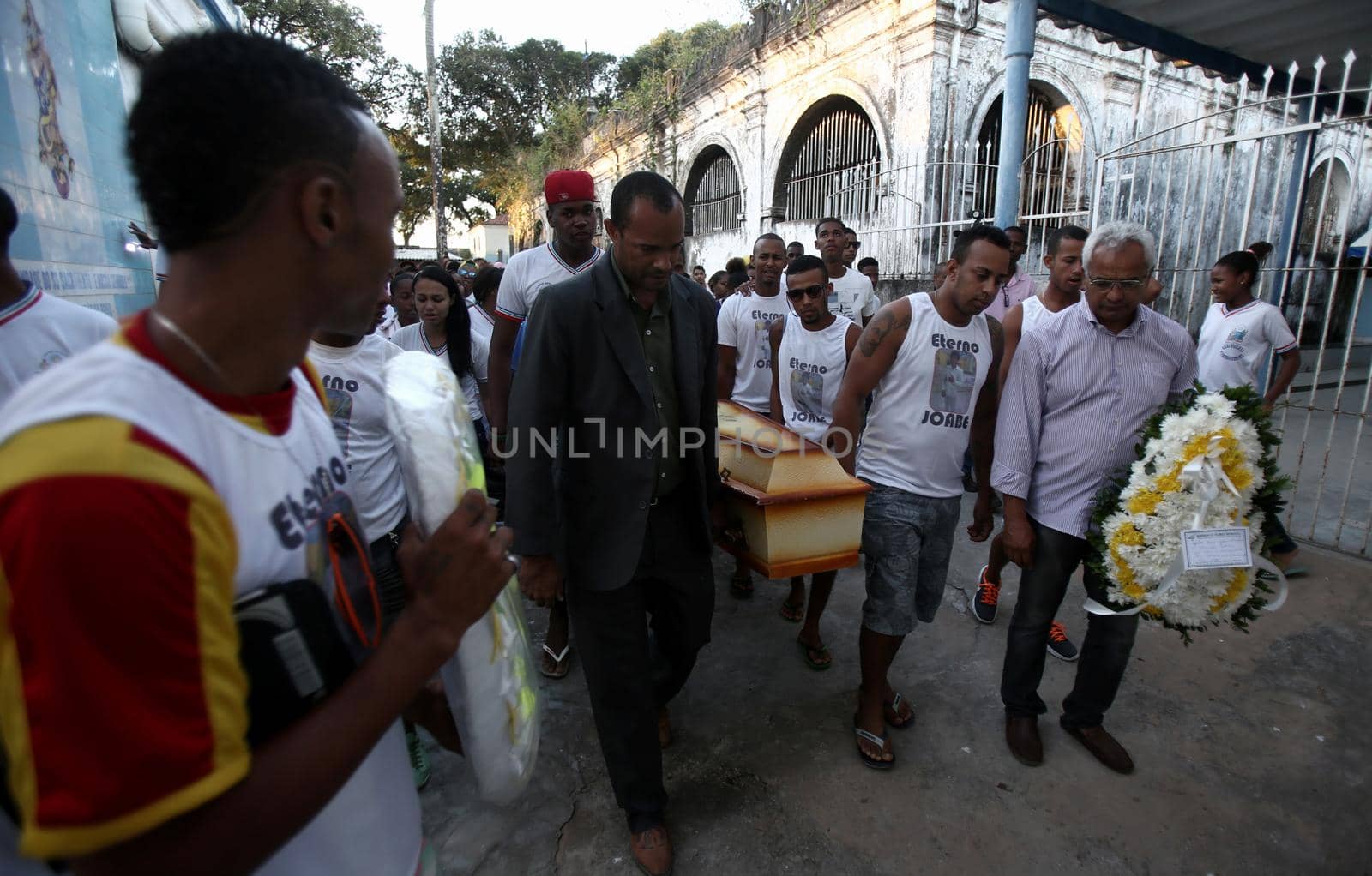salvador, bahia / brazil - september 18, 2015: people cart casket with dead relative body for burial in the Quinta dos Lazaros cemetery in Salvador city.

